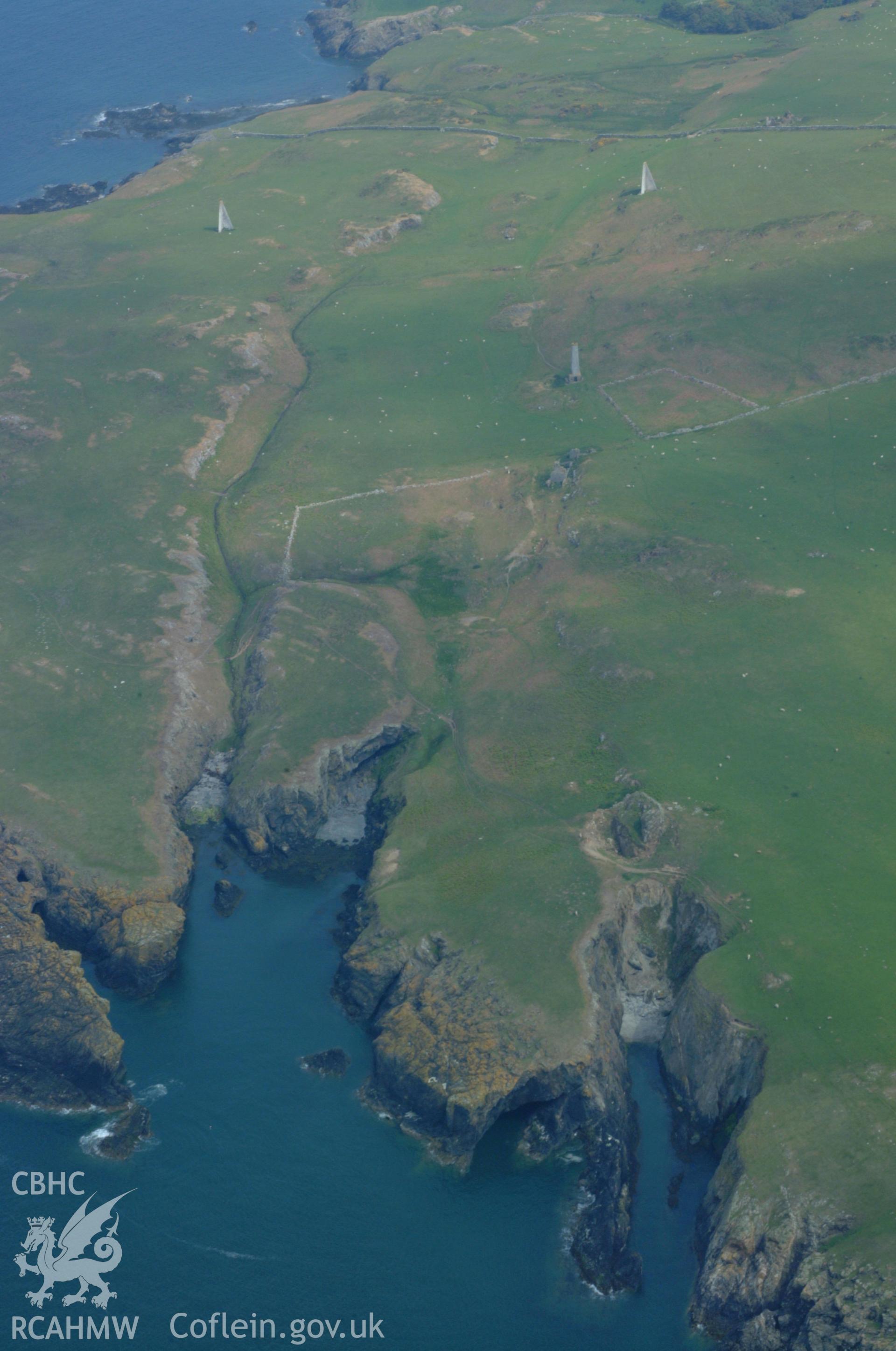 RCAHMW colour oblique aerial photograph of Pilot Beacons, Carmel Head. Taken on 26 May 2004 by Toby Driver