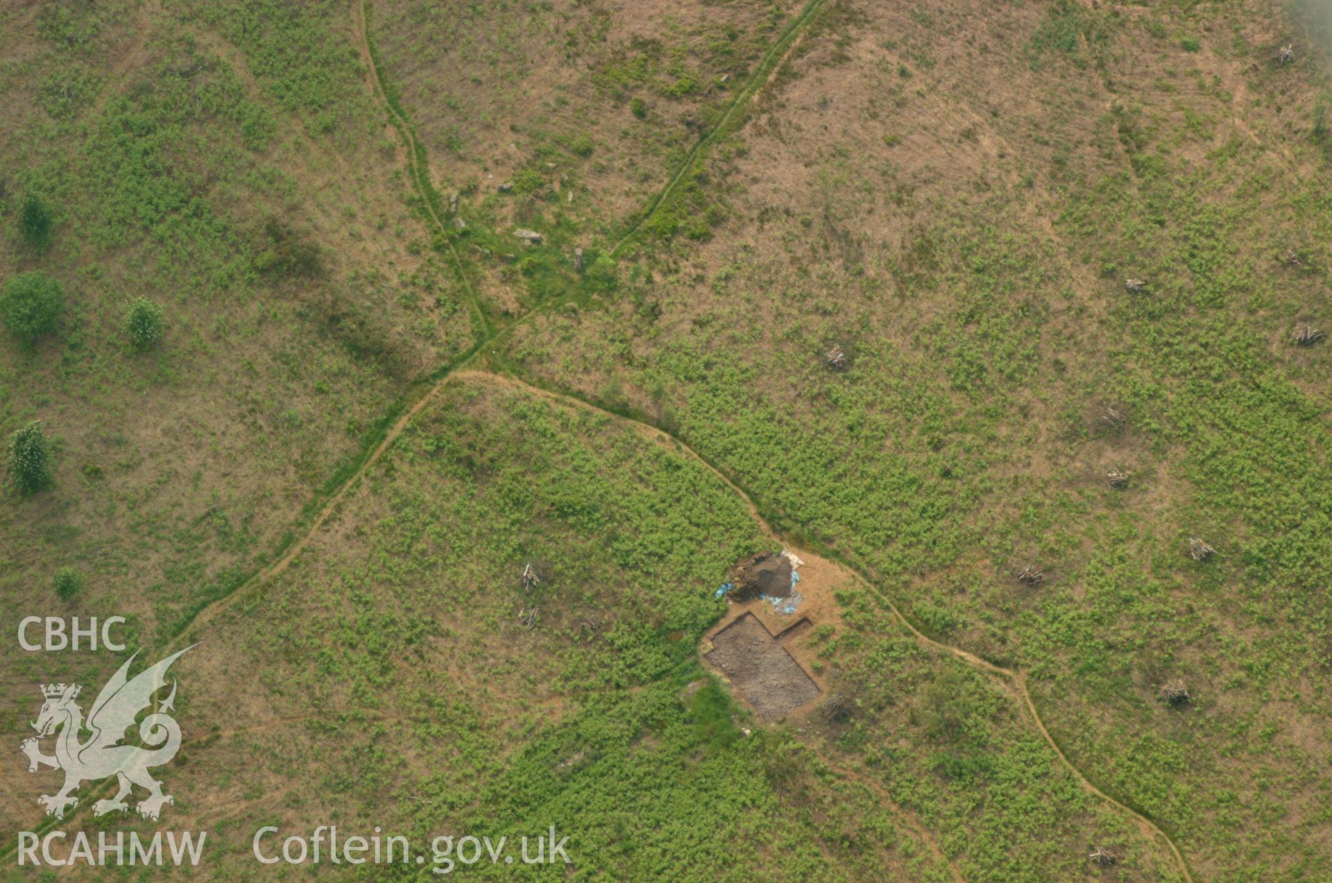 RCAHMW colour oblique aerial photograph of Grey Hill Stone Circle showing excavations by the University of Wales, Newport. Taken on 26 May 2004 by Toby Driver