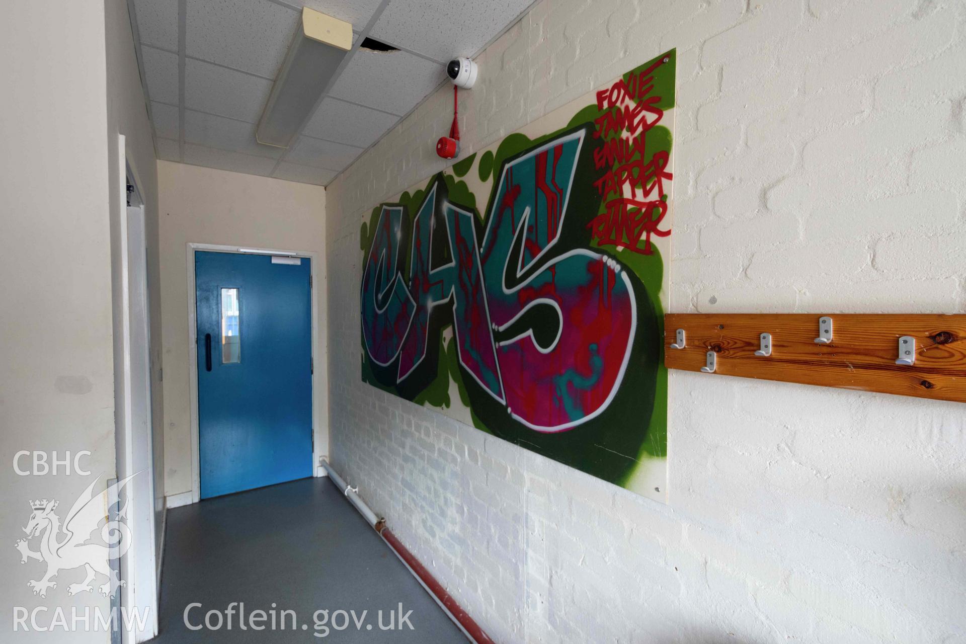 Graffiti display outside staff kitchen and toilets. Ground floor. Cathays High School