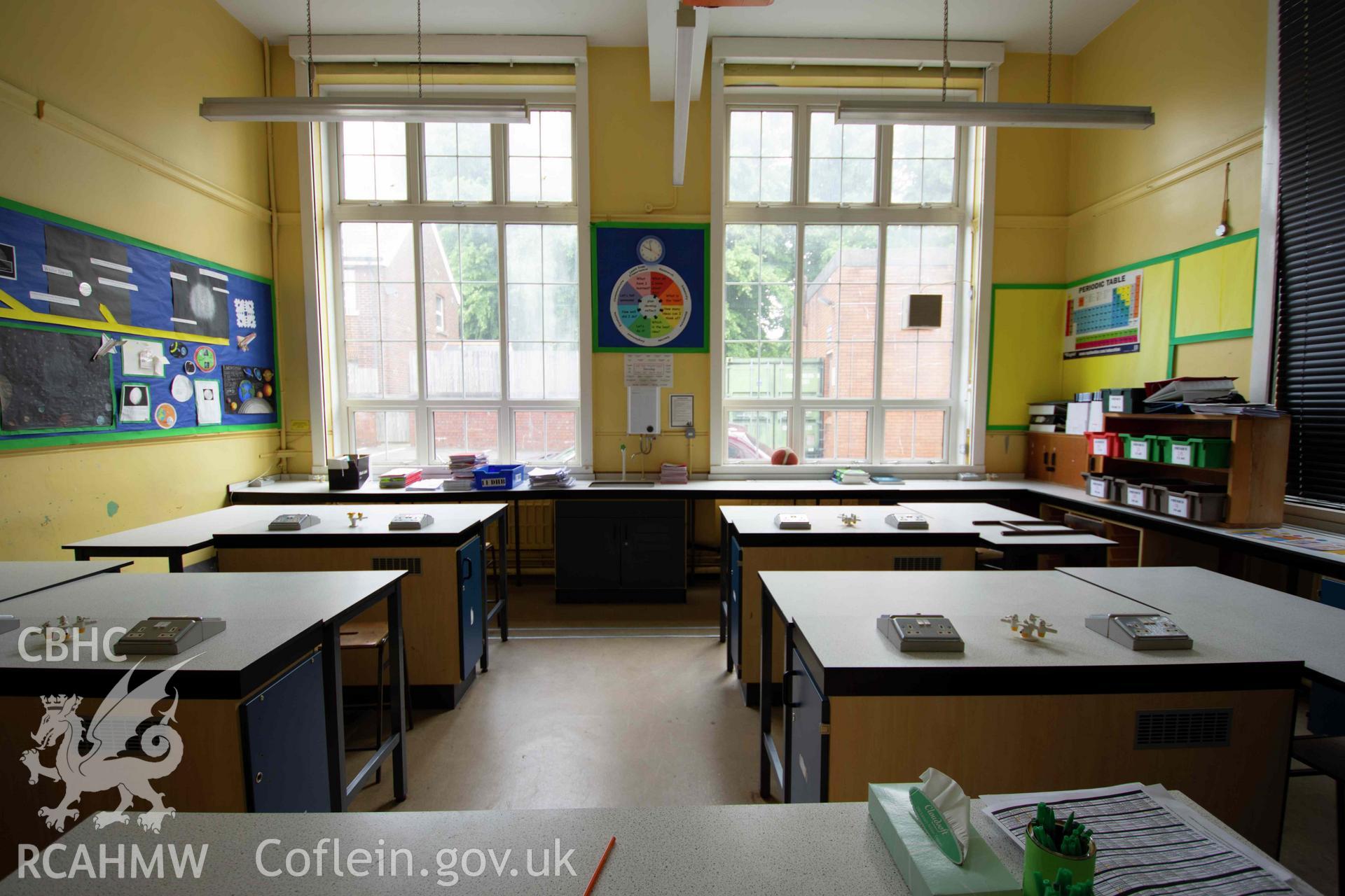 Science room 18. End of north east wing. Large end windows. Ground floor. Cathays High School