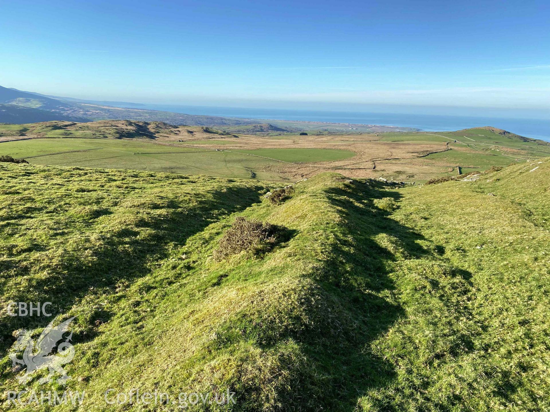 Digital photograph showing south east ramparts of Moel Goedog Hillfort, produced by Paul Davis in 2023