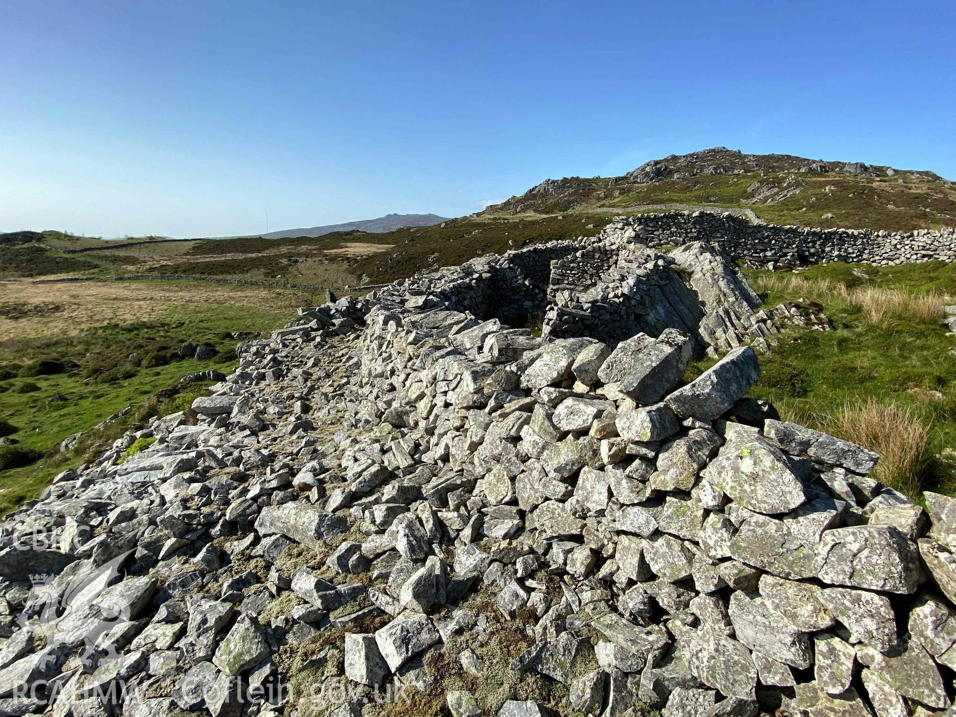 Digital photograph showing the west rampart of Castell Caerau, produced by Paul Davis in 2023