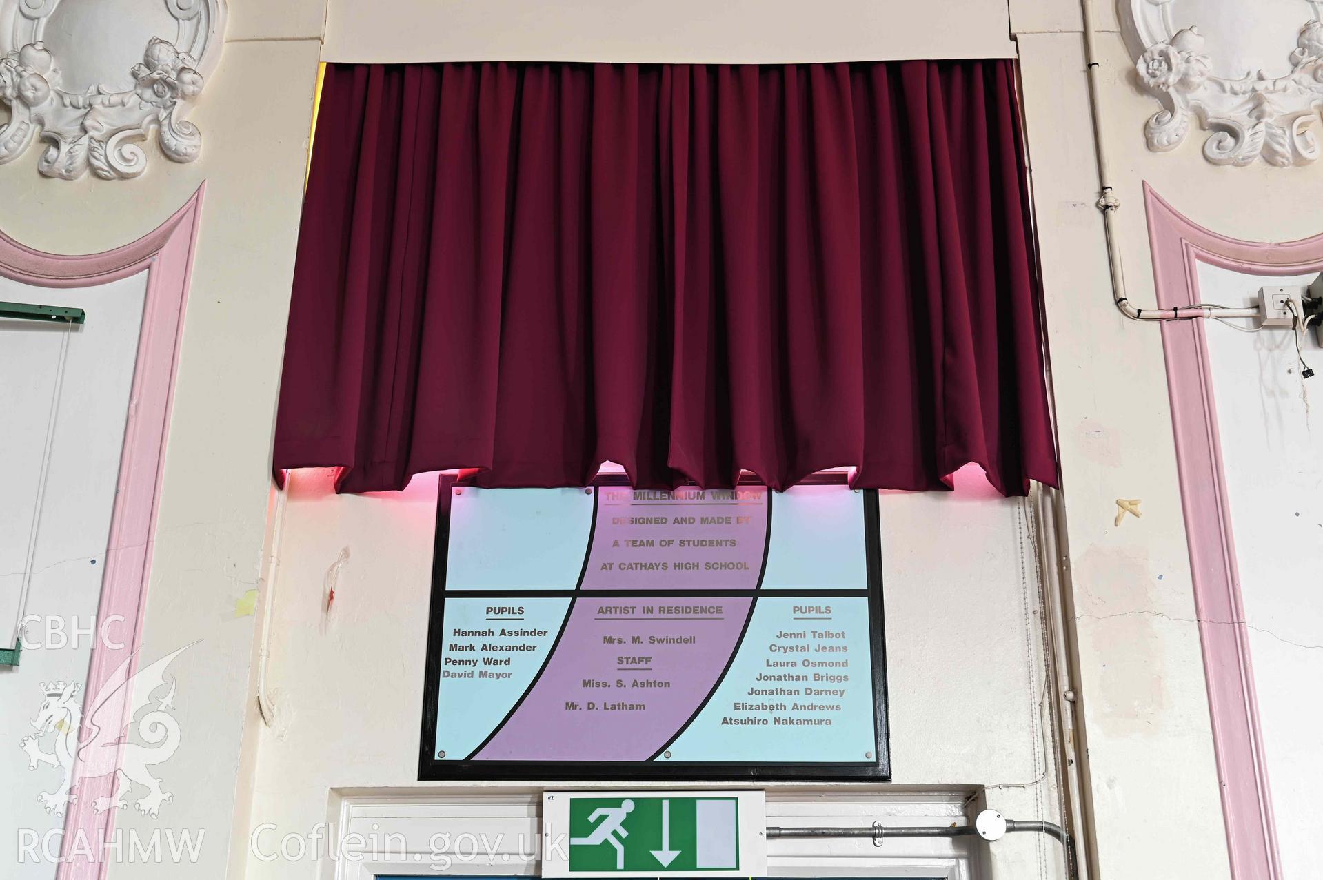 Main hall 'Millennium window' plaque and curtain. First floor. Cathays High School