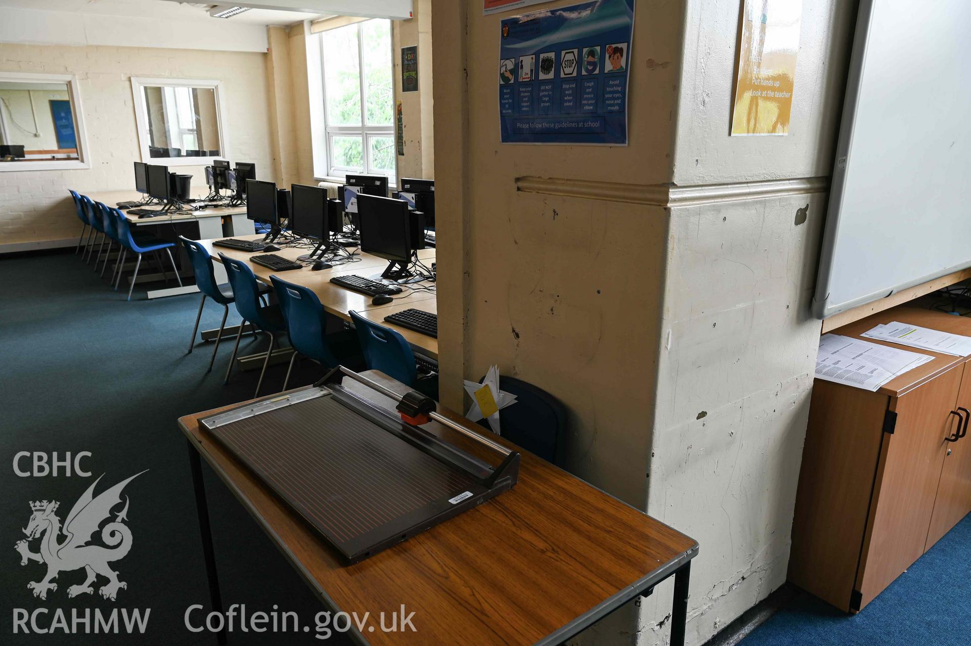 Room 34 6th Form Study Area. Paper cutter and computers. First floor. Cathays High School
