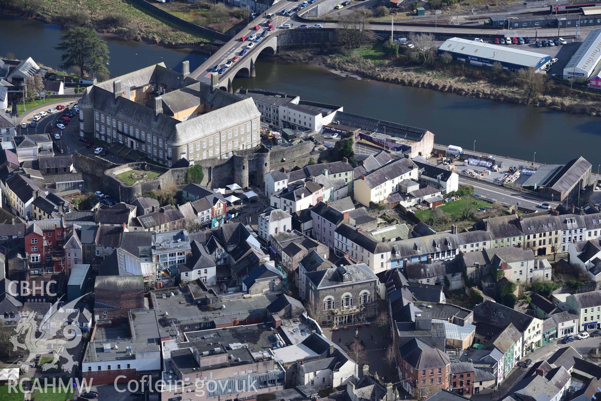 Carmarthen County Hall and Carmarthen Castle. Oblique aerial photograph taken during the Royal Commission’s programme of archaeological aerial reconnaissance by Toby Driver on 14 March 2022.