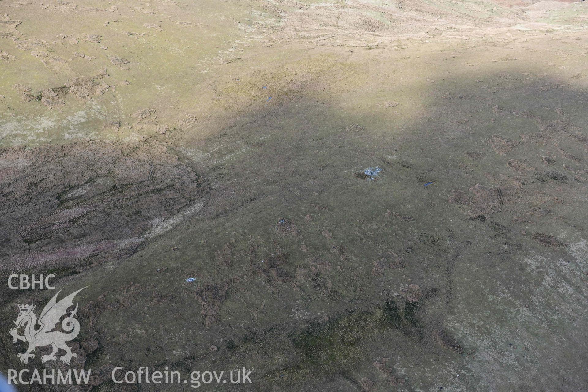 Darren stone pair and cairns. Oblique aerial photograph taken during the Royal Commission’s programme of archaeological aerial reconnaissance by Toby Driver on 14 March 2022.