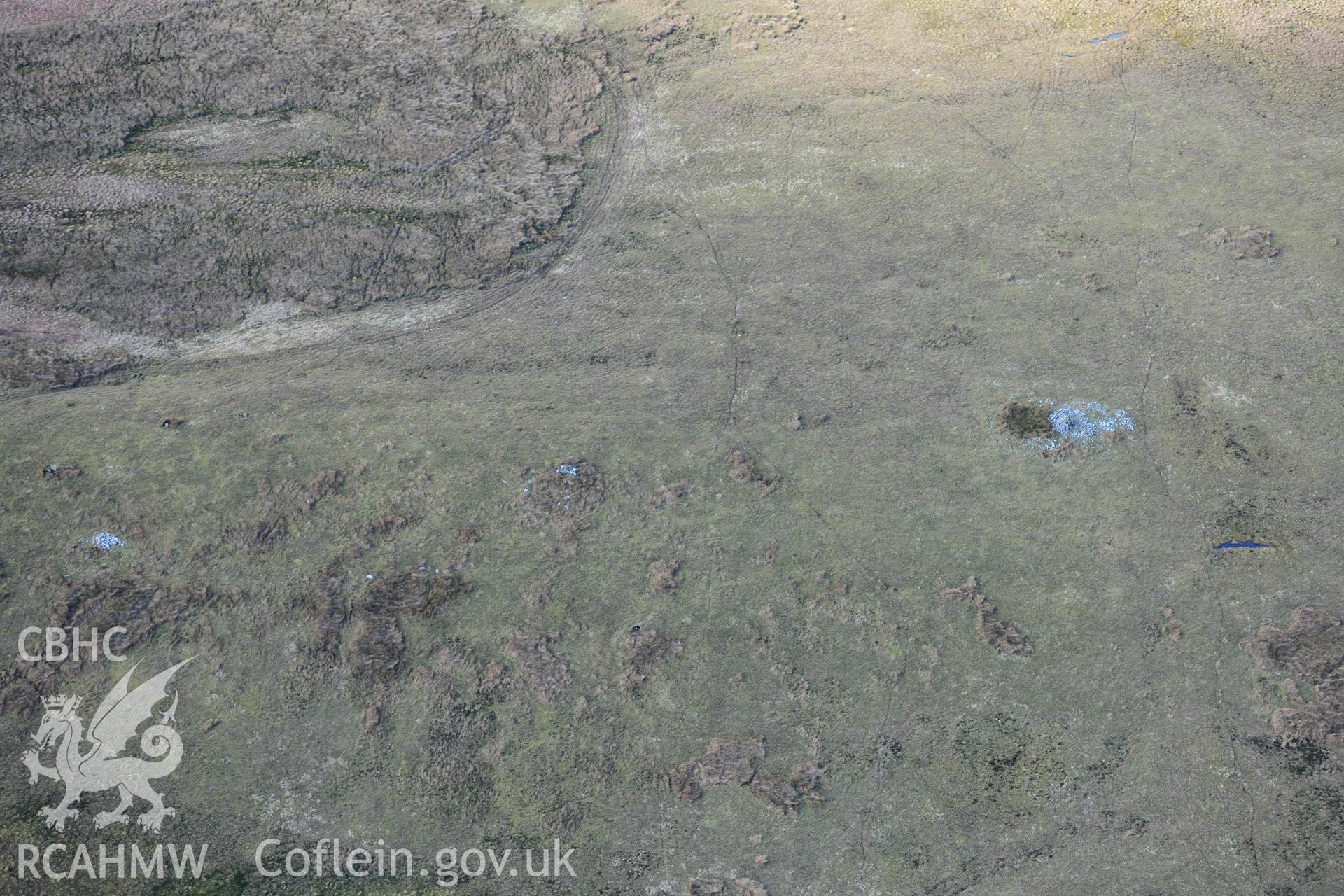 Darren stone pair and cairns, view from the south. Oblique aerial photograph taken during the Royal Commission’s programme of archaeological aerial reconnaissance by Toby Driver on 14 March 2022.