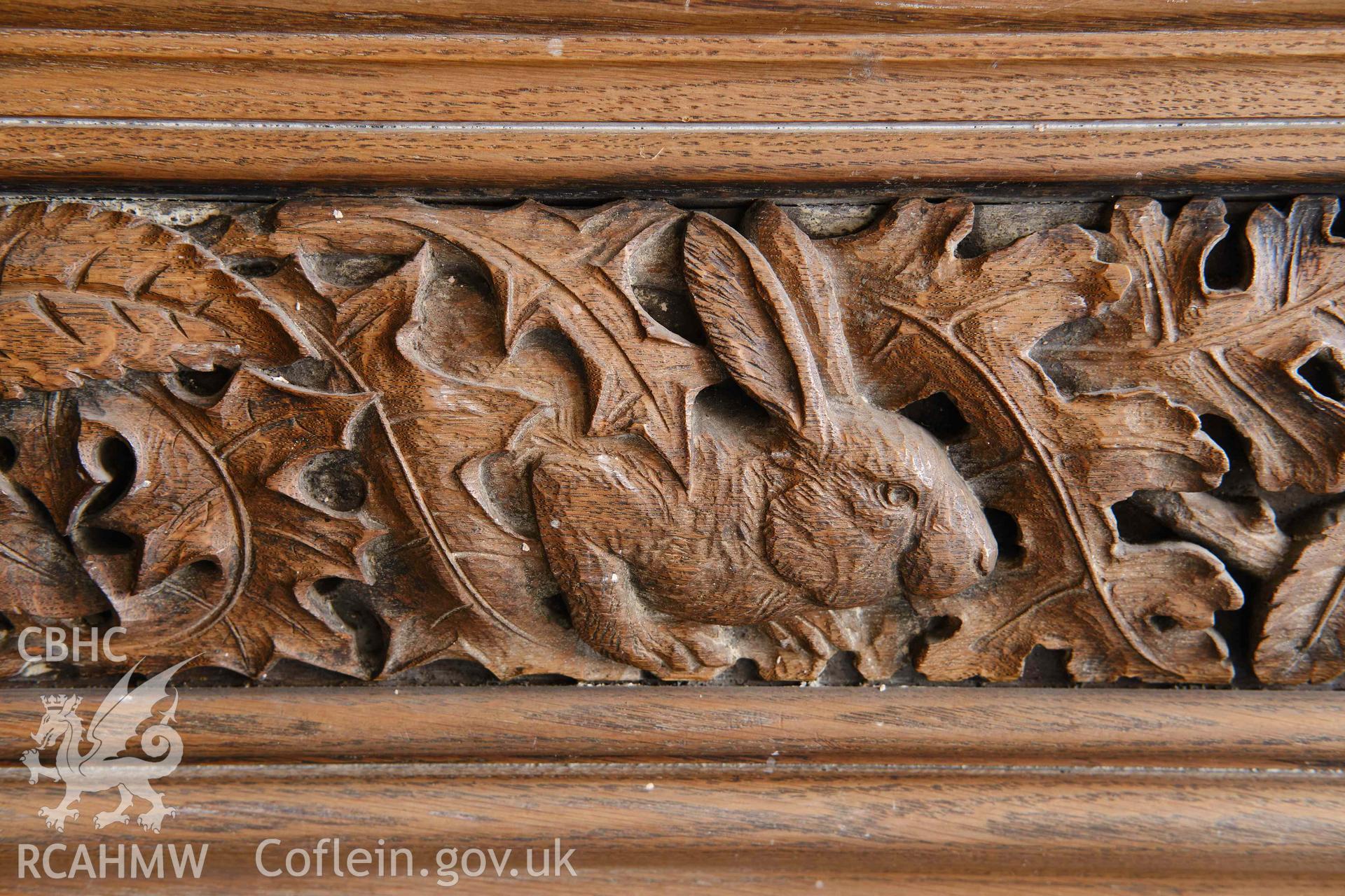 First floor: detail of timber frieze over fireplace