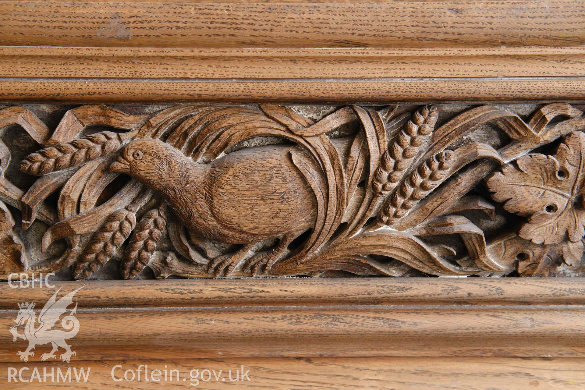 First floor: detail of timber frieze over fireplace