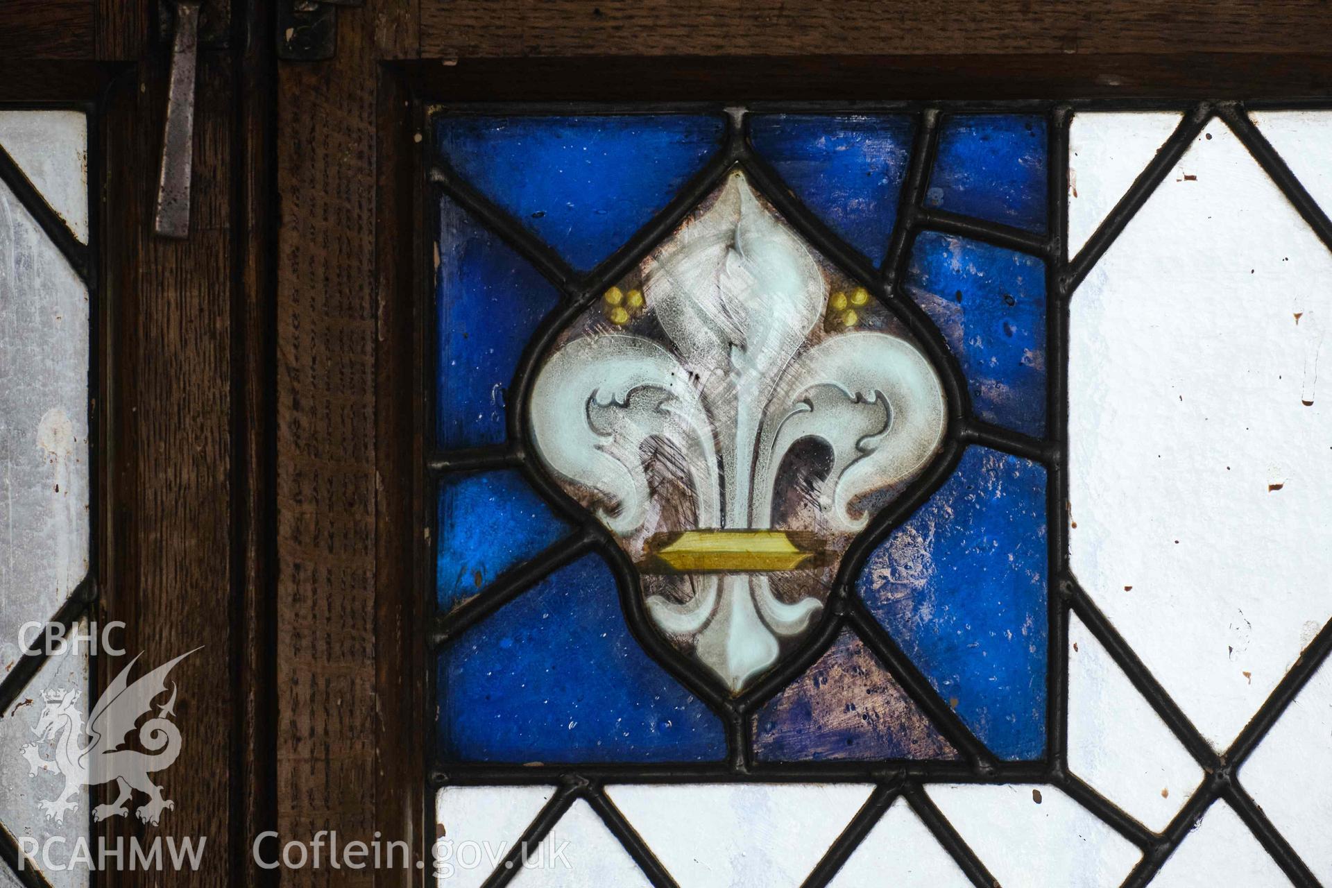 First floor: E window stained glass panel (fleur-de-lys)