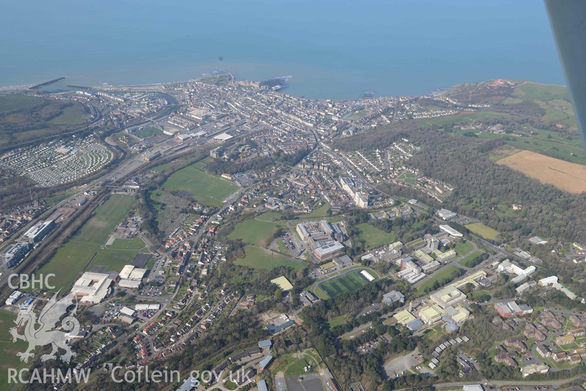 Aberystwyth town, viewed from the east. Oblique aerial photographs taken during the Royal Commission’s programme of archaeological aerial reconnaissance by Toby Driver on 25 March 2022.