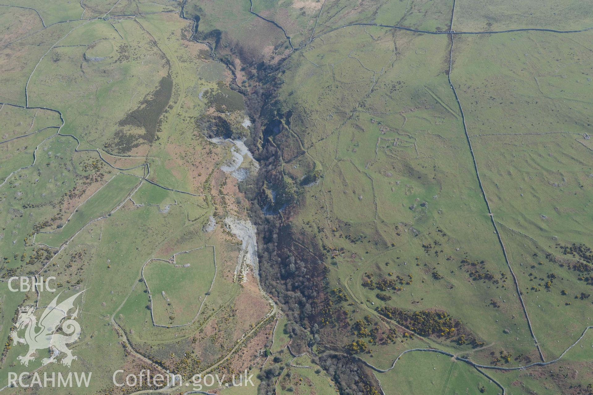 Settlement and fields above Egryn Abbey. Oblique aerial photograph taken during the Royal Commission’s programme of archaeological aerial reconnaissance by Toby Driver on 25 March 2022.