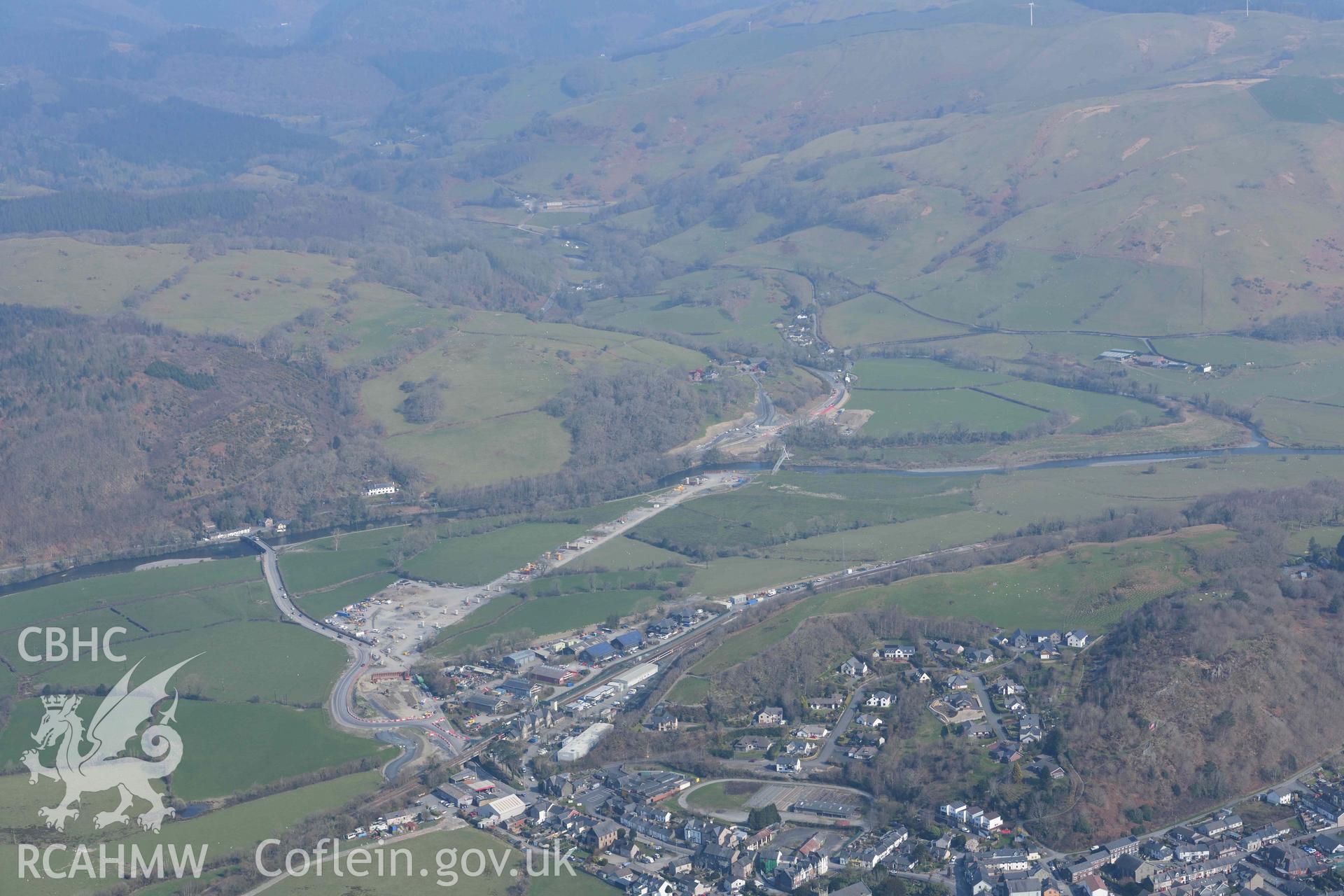 View of Dyfi viaduct works and Machynlleth town. Oblique aerial photographs taken during the Royal Commission’s programme of archaeological aerial reconnaissance by Toby Driver on 25 March 2022.