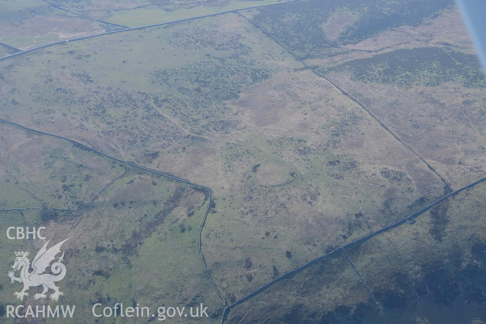 Morfa enclosure and field system. Oblique aerial photograph taken during the Royal Commission’s programme of archaeological aerial reconnaissance by Toby Driver on 25 March 2022.