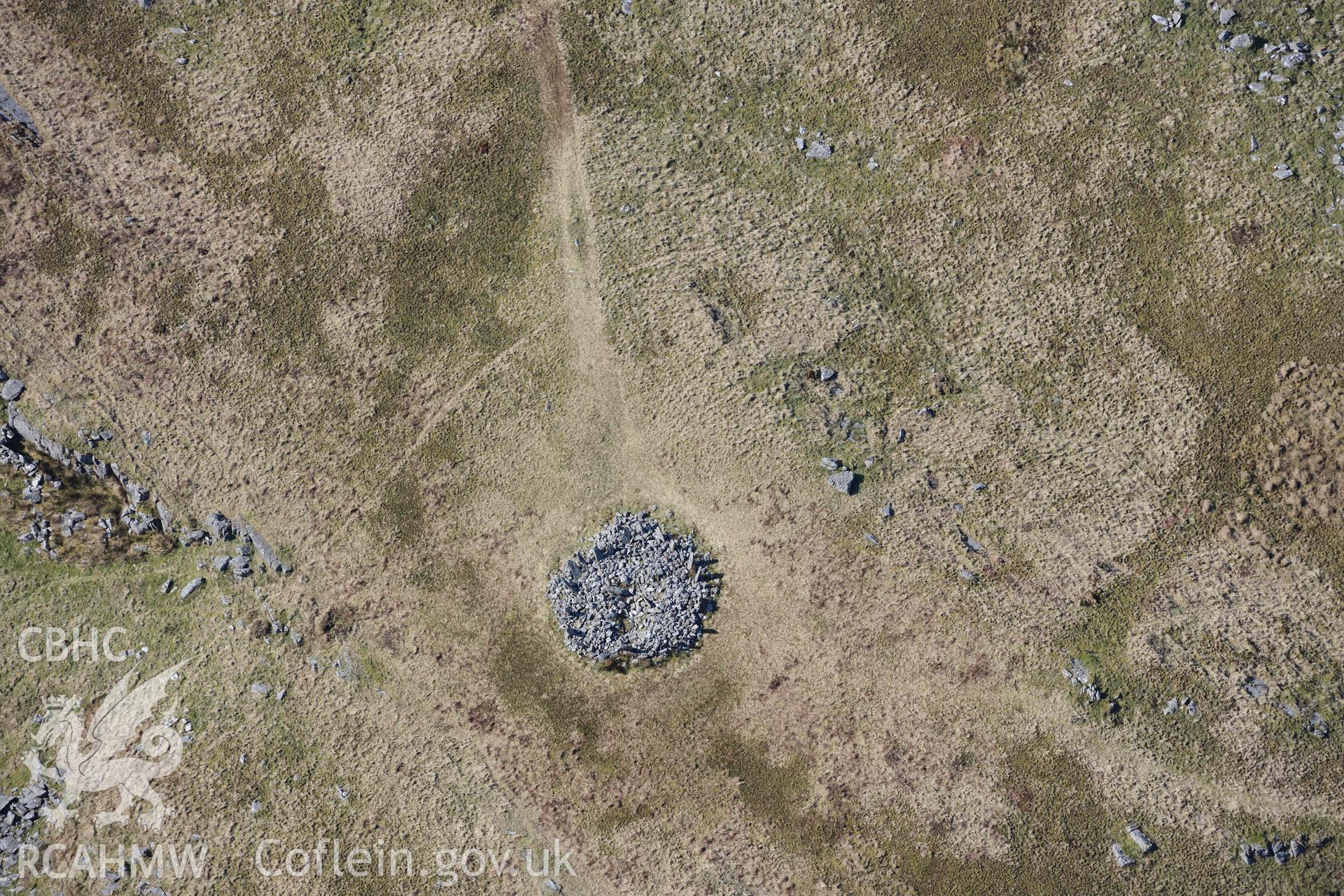 Bryn Cader Faner round cairn. Oblique aerial photograph taken during the Royal Commission’s programme of archaeological aerial reconnaissance by Toby Driver on 25 March 2022.