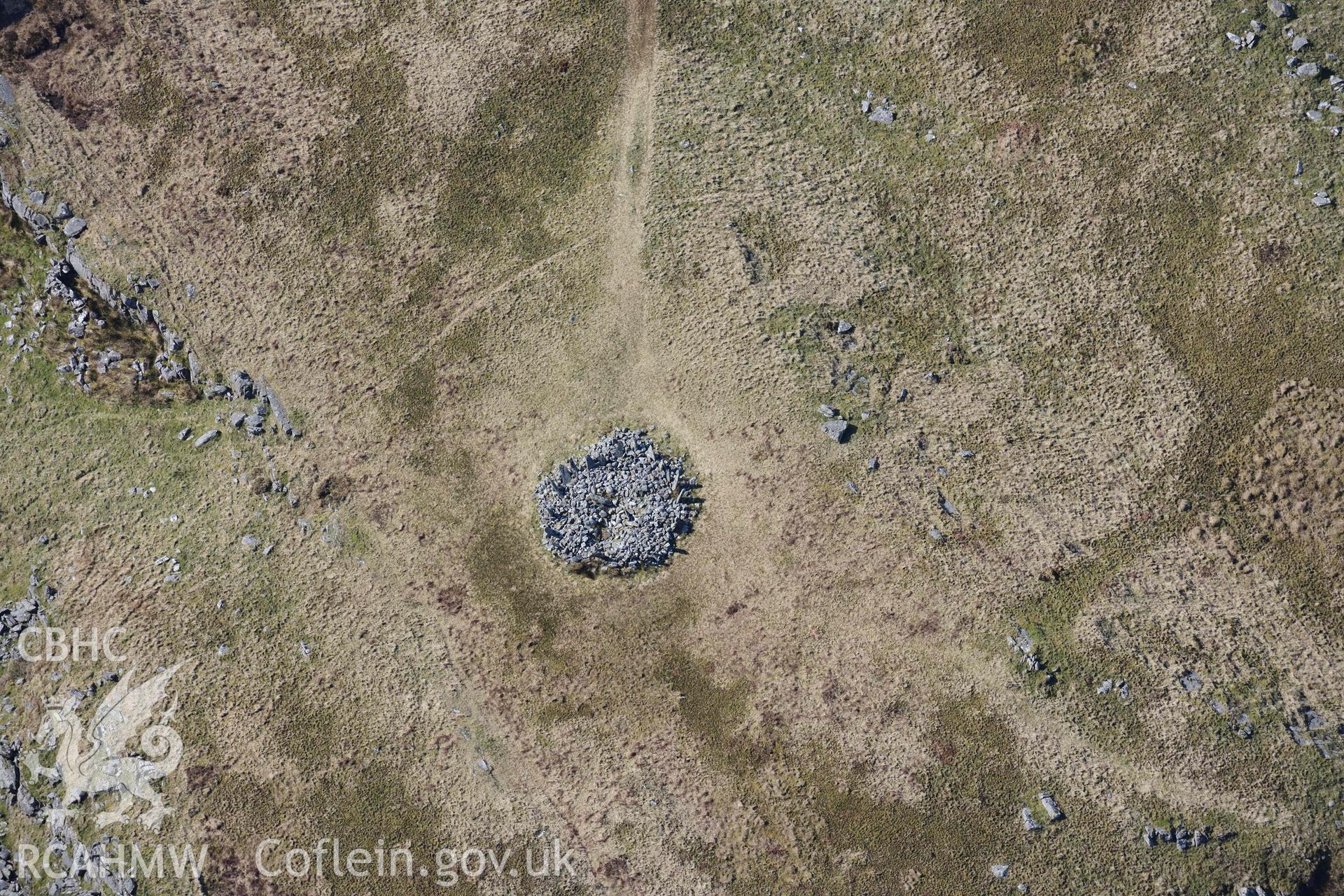 Bryn Cader Faner round cairn. Oblique aerial photograph taken during the Royal Commission’s programme of archaeological aerial reconnaissance by Toby Driver on 25 March 2022.