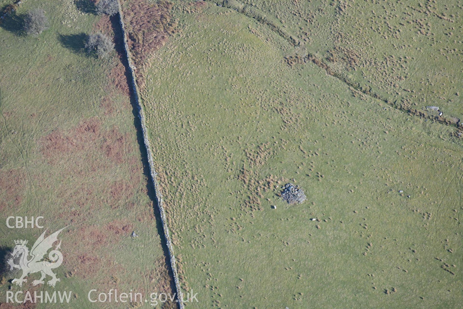 Tyddyn Sion Wyn ring cairn. Oblique aerial photograph taken during the Royal Commission’s programme of archaeological aerial reconnaissance by Toby Driver on 25 March 2022.