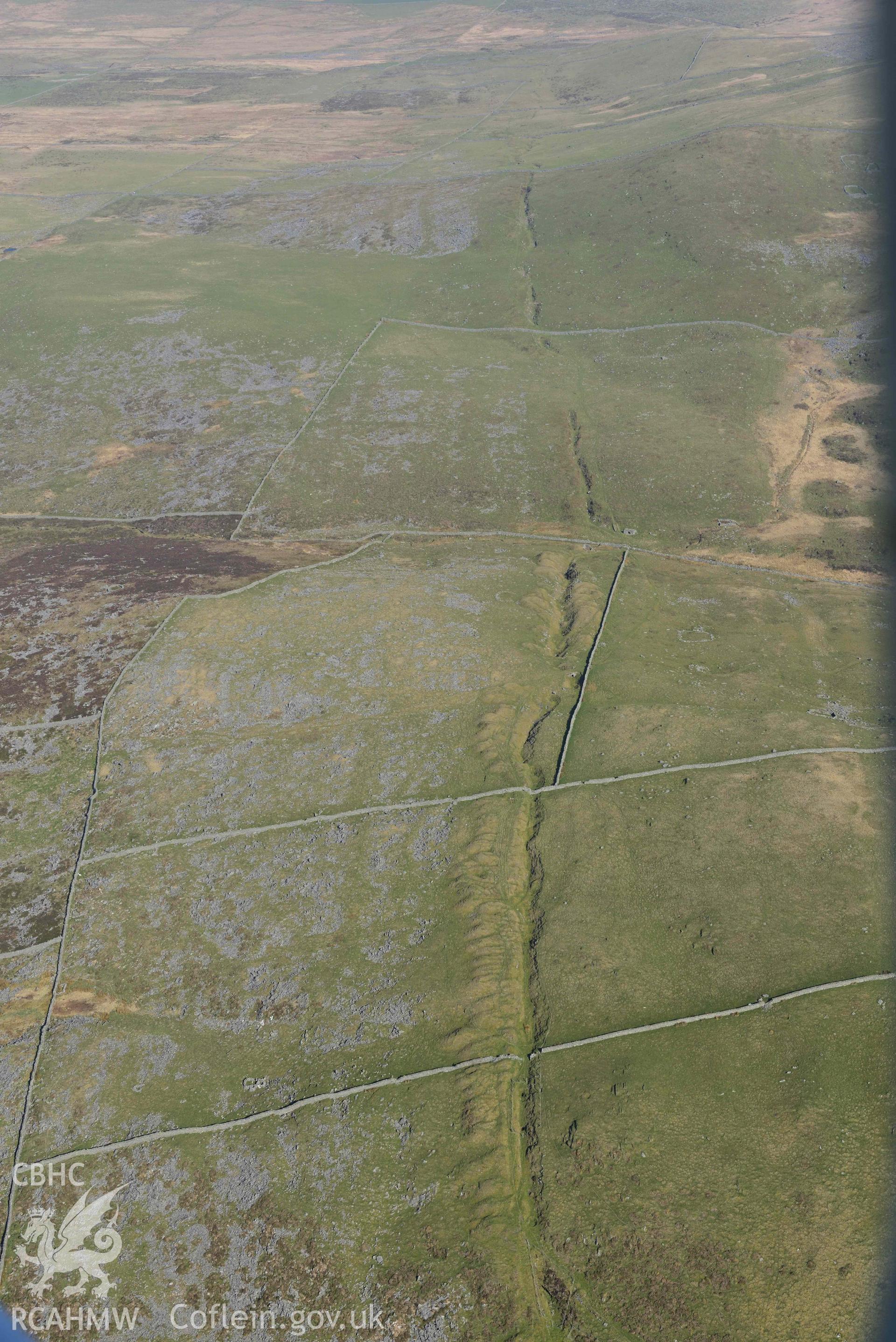 Ergyn and Hafotty manganese mines, view from the south. Oblique aerial photograph taken during the Royal Commission’s programme of archaeological aerial reconnaissance by Toby Driver on 25 March 2022.