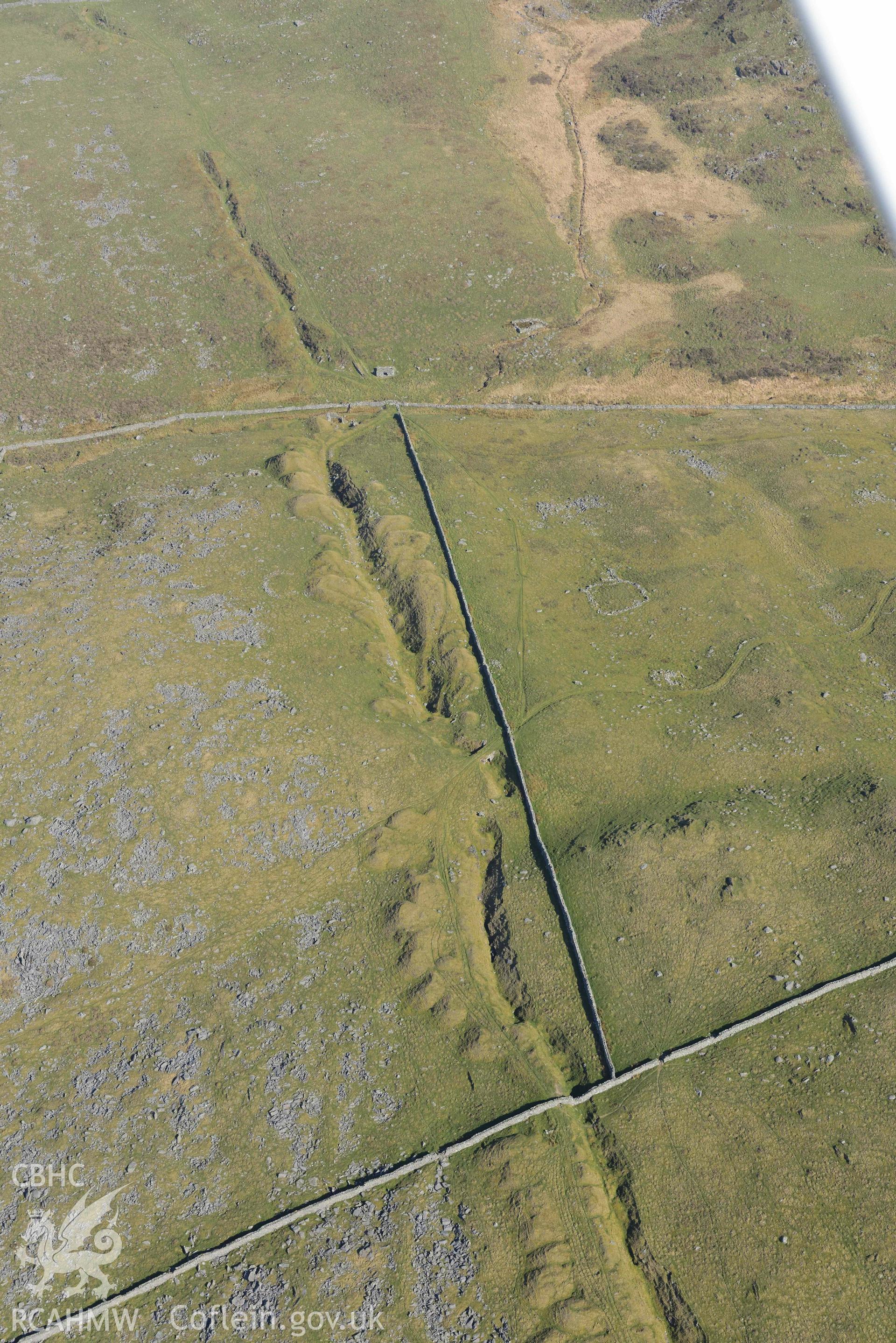 Ergyn and Hafotty manganese mines, with sheepfold. Oblique aerial photograph taken during the Royal Commission’s programme of archaeological aerial reconnaissance by Toby Driver on 25 March 2022.