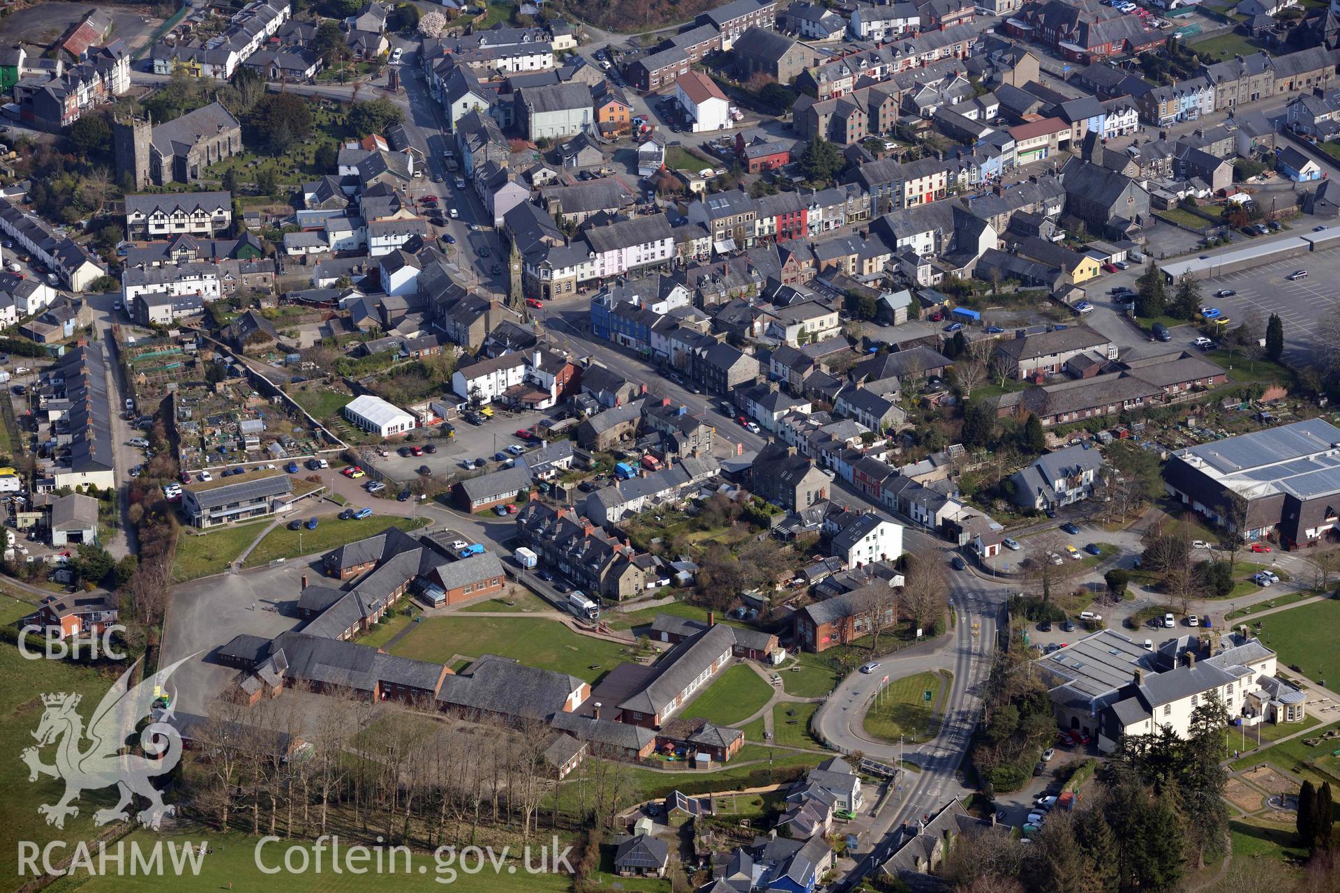 Machynlleth Town, view over Ysgol Bro Hyddgen. Oblique aerial photograph taken during the Royal Commission’s programme of archaeological aerial reconnaissance by Toby Driver on 25 March 2022.