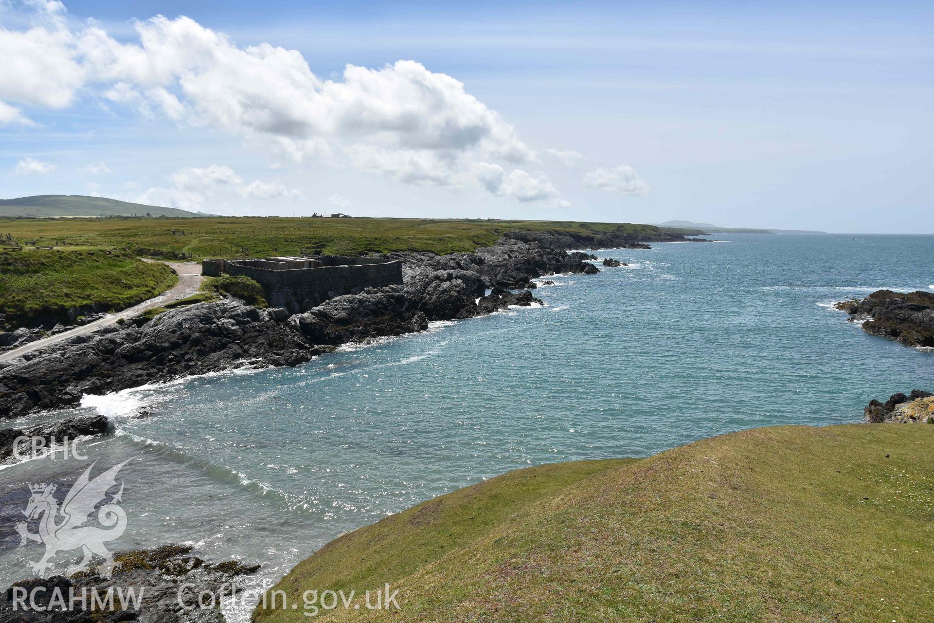 Boat Yard, Porth Ysgaden. View from the north. Distant view from the north. Photographed by Louise Barker of RCAHMW, 9th June 2017. Produced with EU funds through the Ireland Wales Co-operation Programme 2014-2023. All material made freely available through the Open Government Licence.