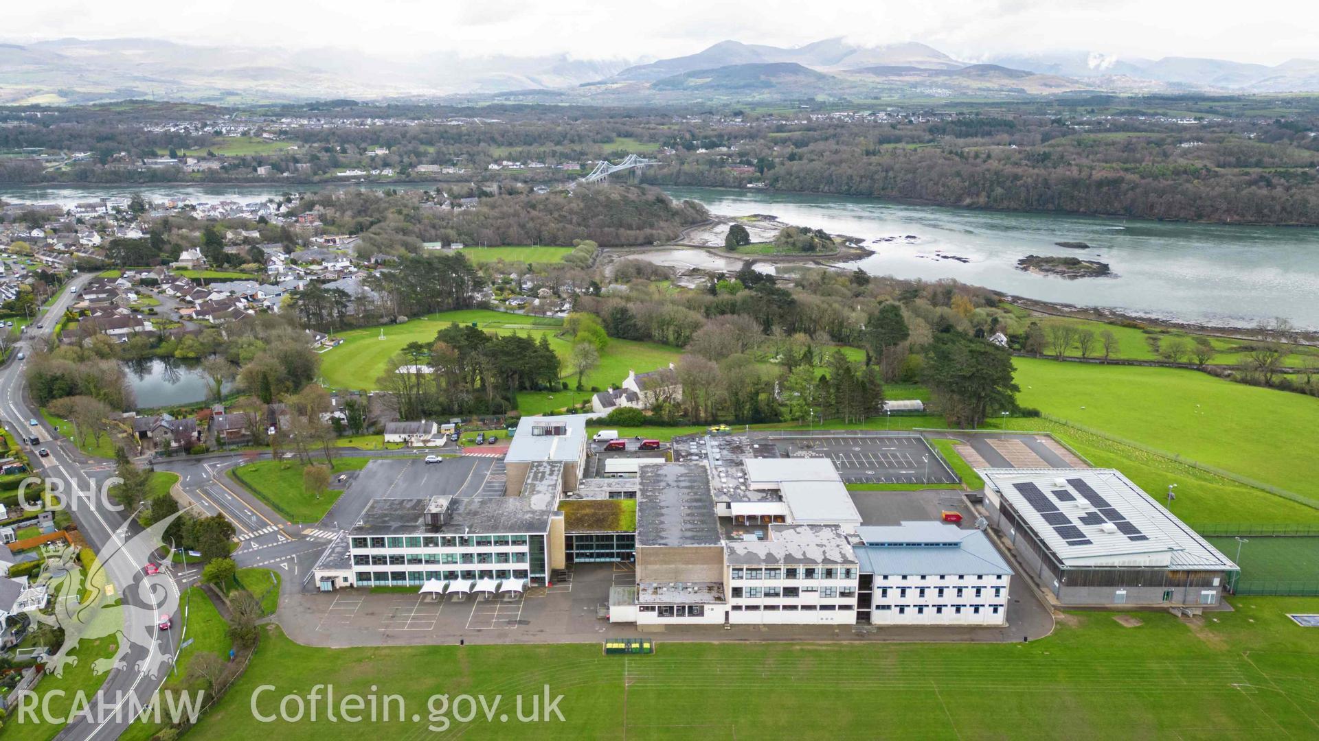 Aerial oblique view of Ysgol David Hughes and surrounding area of Porthaethwy and Menai straits. Looking south east