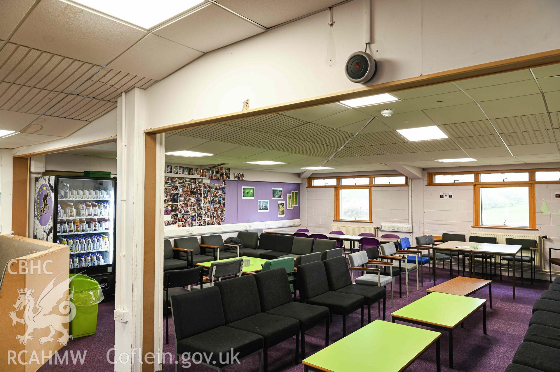 Sixth Form room. Seating area and vending machine. West wing, second floor. Ysgol David Hughes