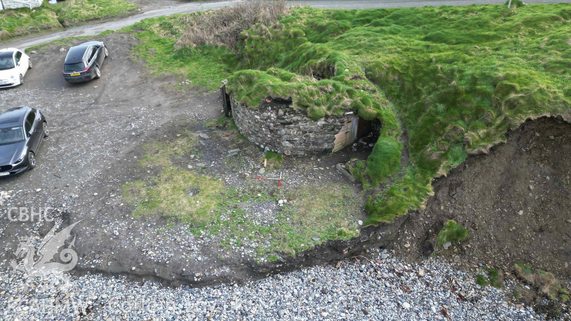 Oblique view, looking east, of Abereiddy Lime Kiln 1 on 20/03/2024. Scales are 1m.