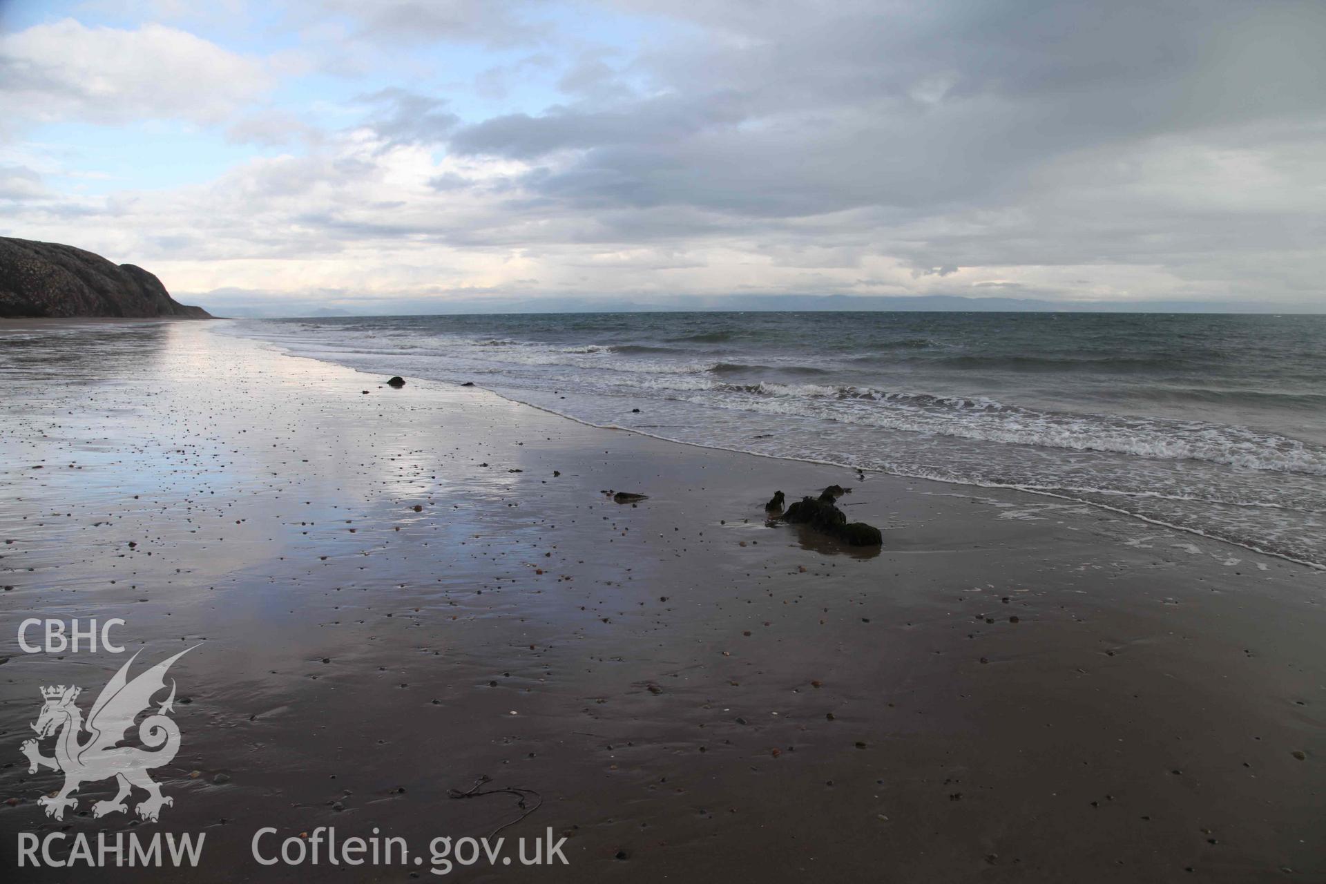 Unnamed Wreck (Fosil?) on The Warren Beach, Abersoch, looking east. Stern in foreground. Photographed by Edward Pollard on 1 October 2019. Crown Copyright. CHERISH project. Produced with EU funds through the Ireland Wales Co-operation Programme 2014-2023. All material made freely available through the Open Government Licence.