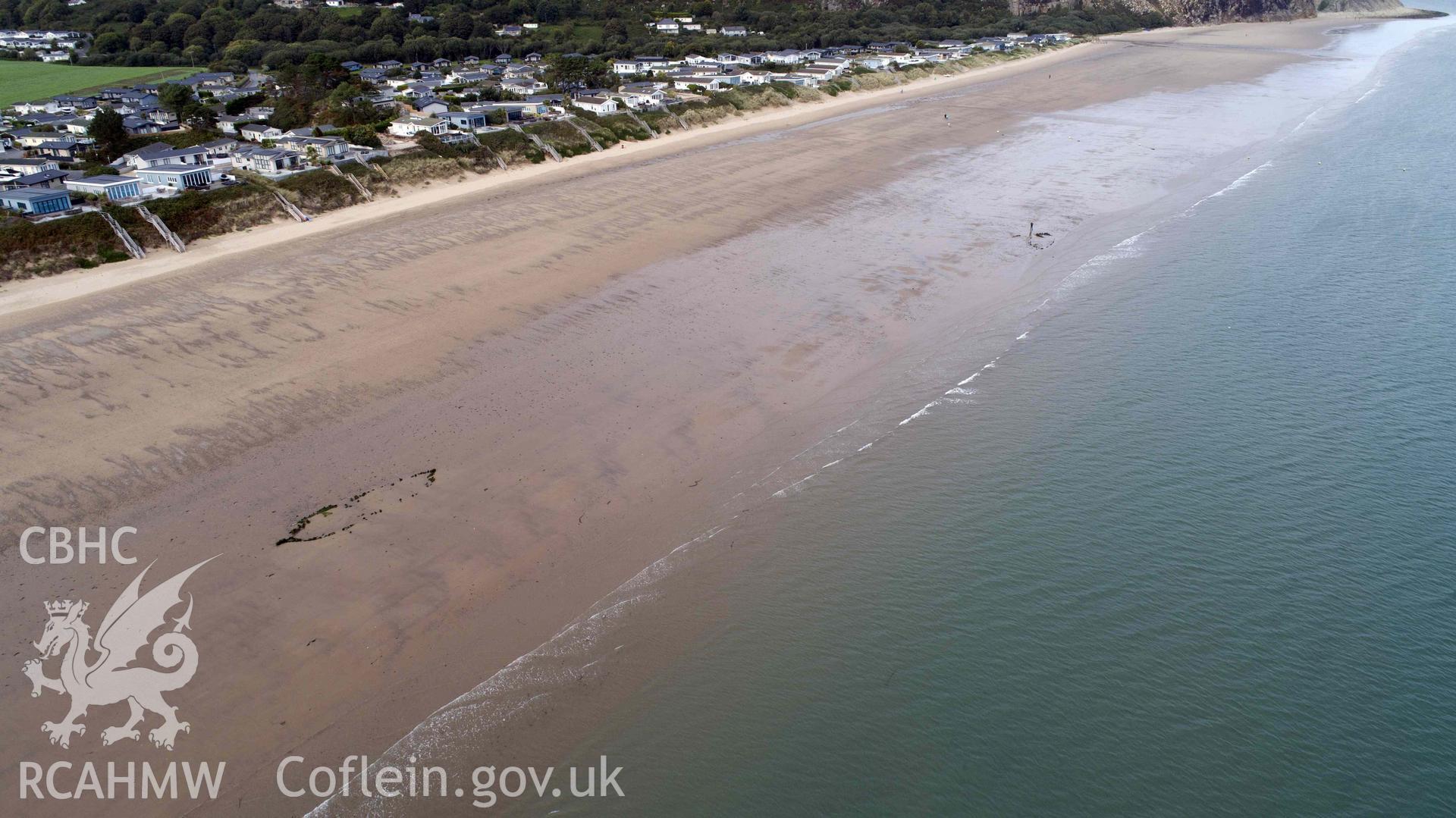 UAV photograph showing two unnamed wrecks on the Warren Beach. Fosil? (NPRN 418877) on the left and Maria? (NPRN 423310) on the right. Photographed by Daniel Hunt on 11 September 2018. Crown Copyright. CHERISH project. Produced with EU funds through the Ireland Wales Co-operation Programme 2014-2023. All material made freely available through the Open Government Licence.