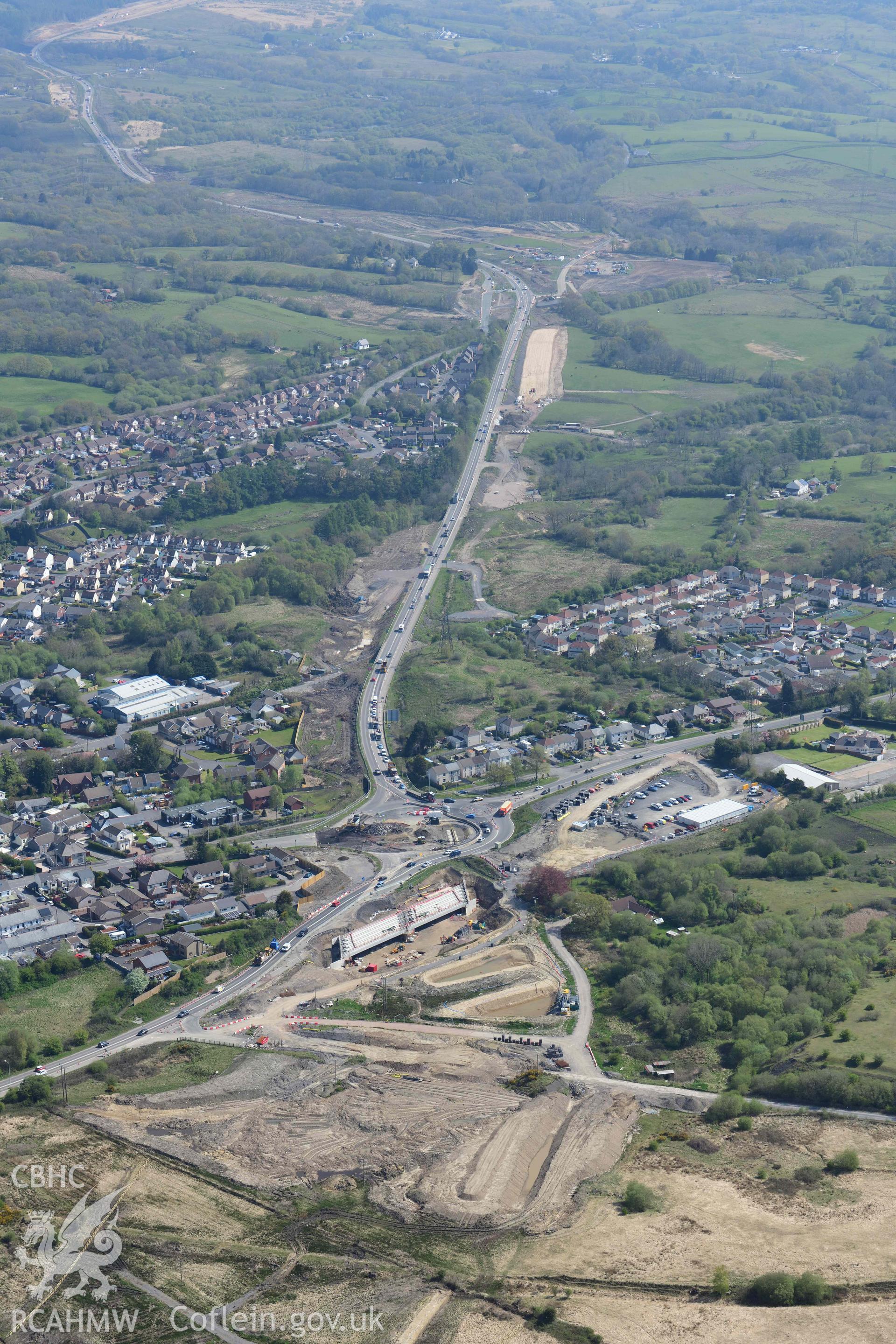 A465 road improvements, Hirwaun, view looking North East. Oblique aerial photograph taken during the Royal Commission's programme of archaeological aerial reconnaissance by Toby Driver on 29 April 2022.
