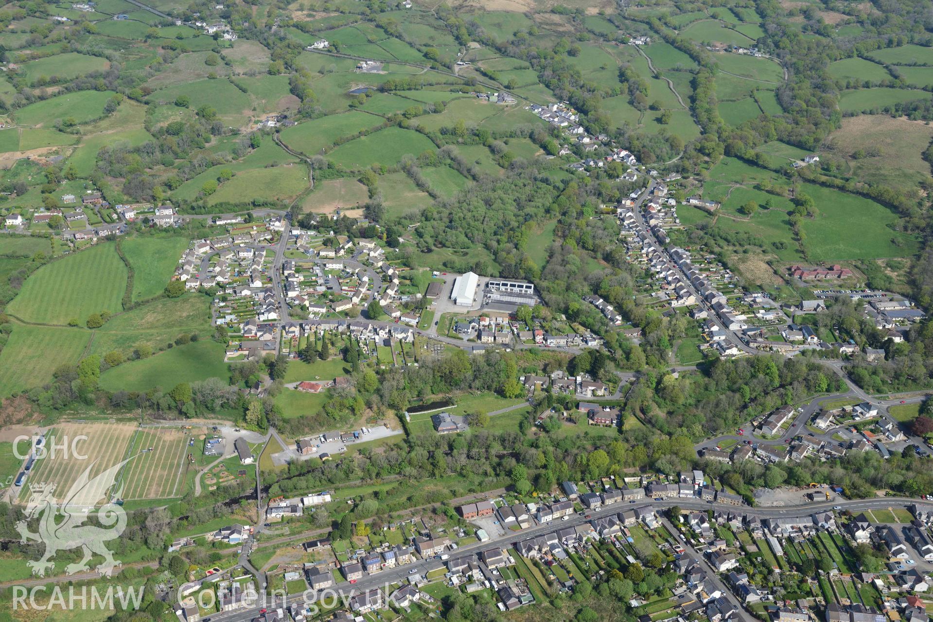 Glanaman townscape, from the south. Oblique aerial photograph taken during the Royal Commission's programme of archaeological aerial reconnaissance by Toby Driver on 29 April 2022.