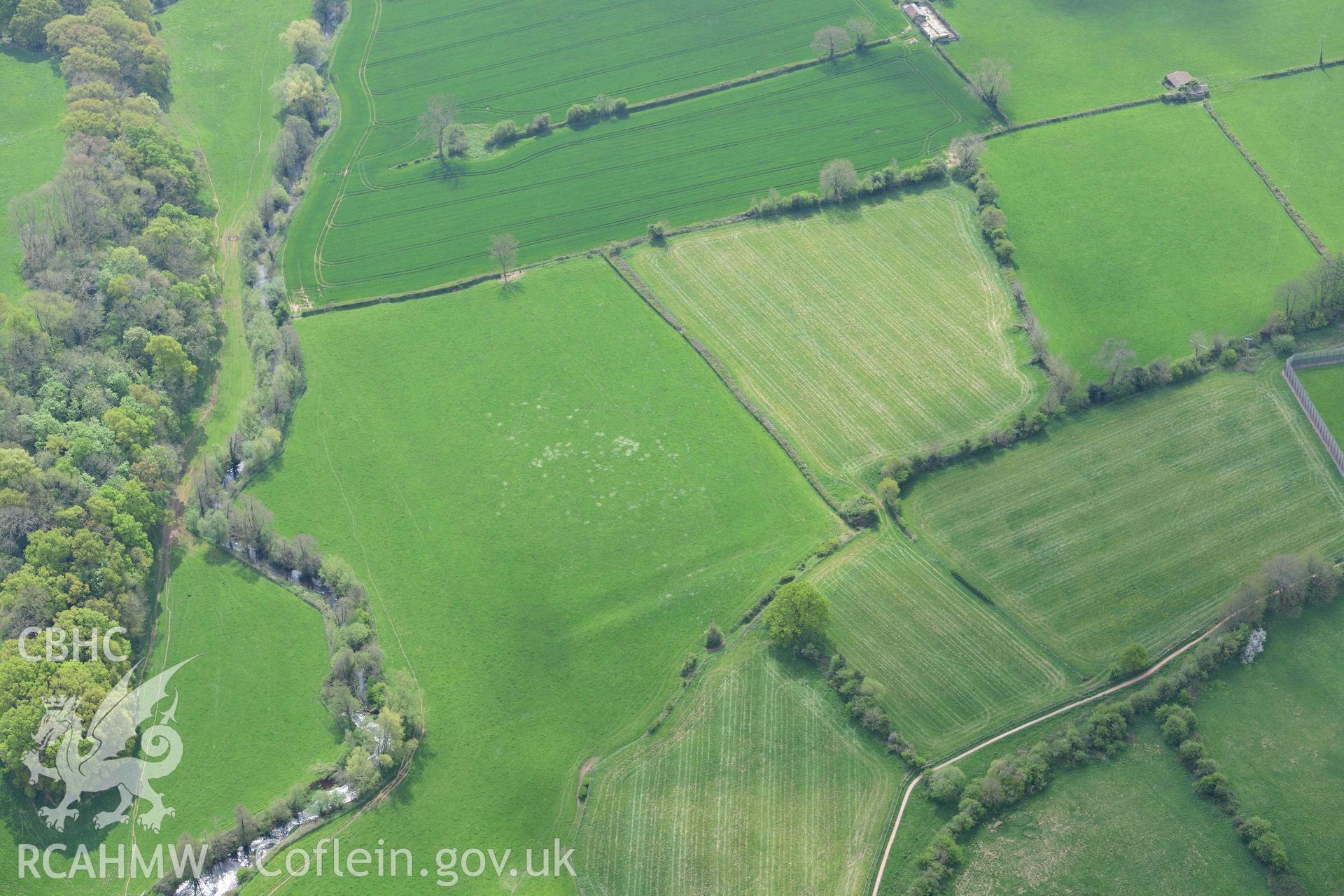 Usk Roman Fort, earthworks. Oblique aerial photograph taken during the Royal Commission's programme of archaeological aerial reconnaissance by Toby Driver on 29 April 2022.