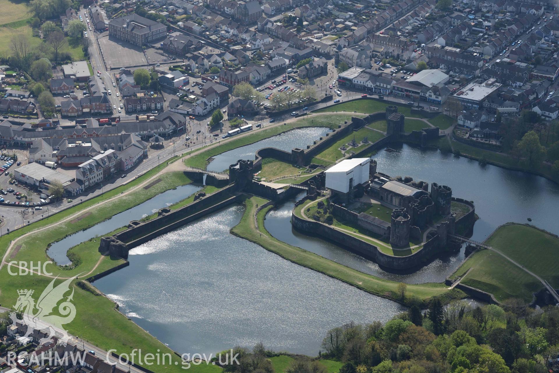 Caerphilly Castle with scaffolded gatehouse. Oblique aerial photograph taken during the Royal Commission's programme of archaeological aerial reconnaissance by Toby Driver on 29 April 2022.