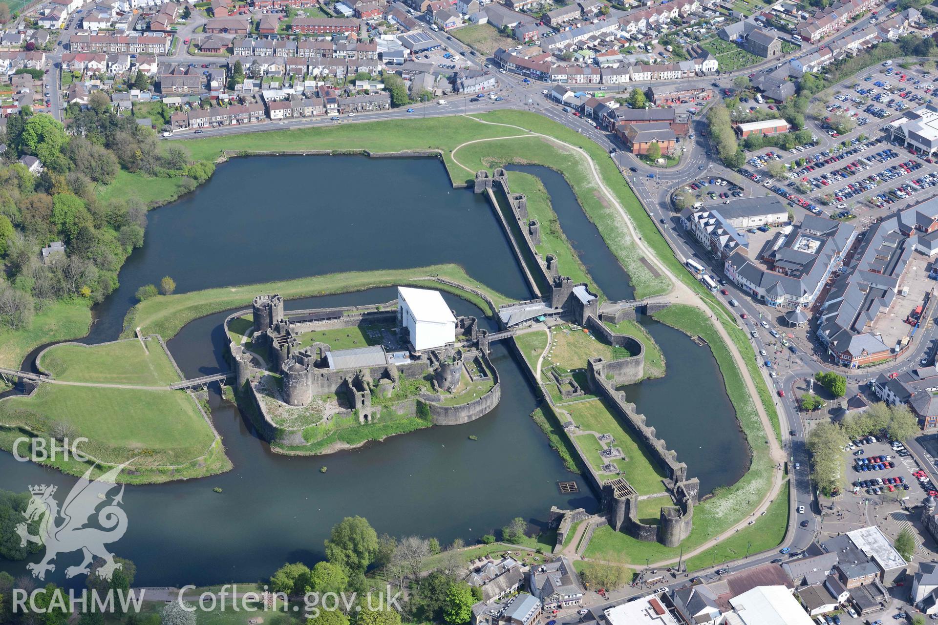 Caerphilly Castle with scaffolded gatehouse. Oblique aerial photograph taken during the Royal Commission's programme of archaeological aerial reconnaissance by Toby Driver on 29 April 2022.