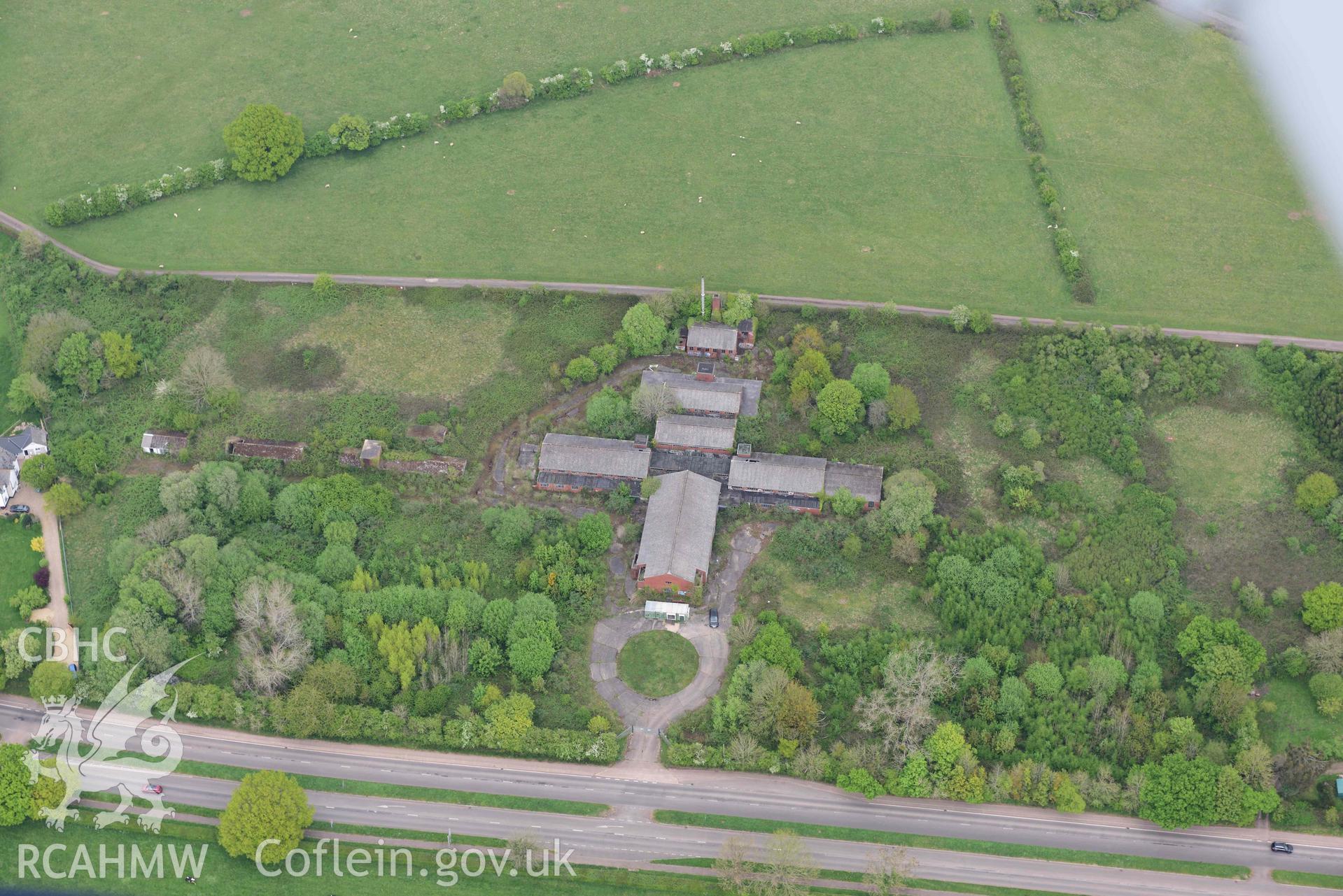 Caerwent Royal Naval Propellant Factory; building complex by Elms Farm. Oblique aerial photograph taken during the Royal Commission's programme of archaeological aerial reconnaissance by Toby Driver on 29 April 2022.