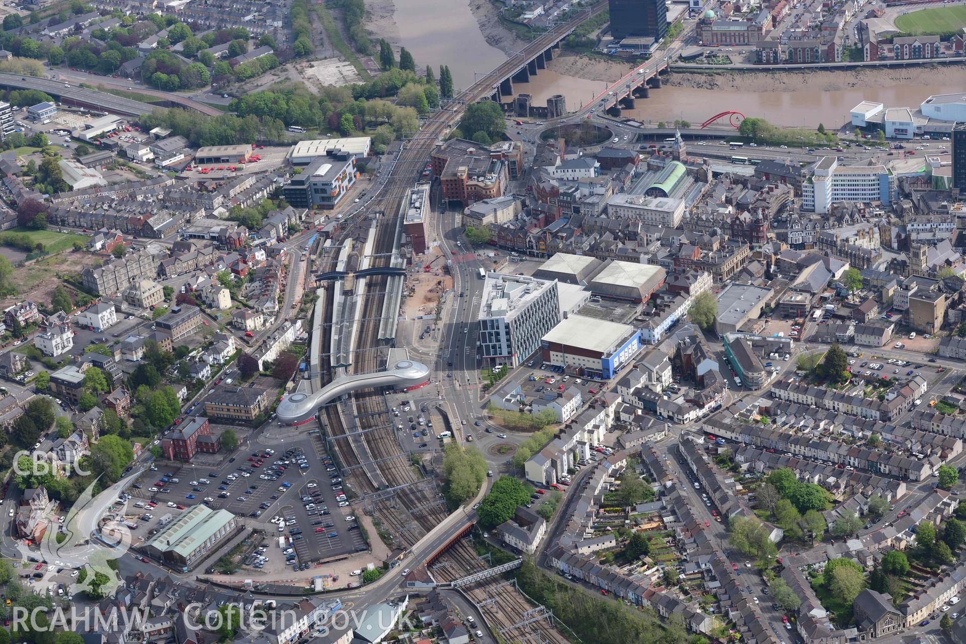 Newport City, view of railway station from the south west. Oblique aerial photograph taken during the Royal Commission's programme of archaeological aerial reconnaissance by Toby Driver on 29 April 2022.