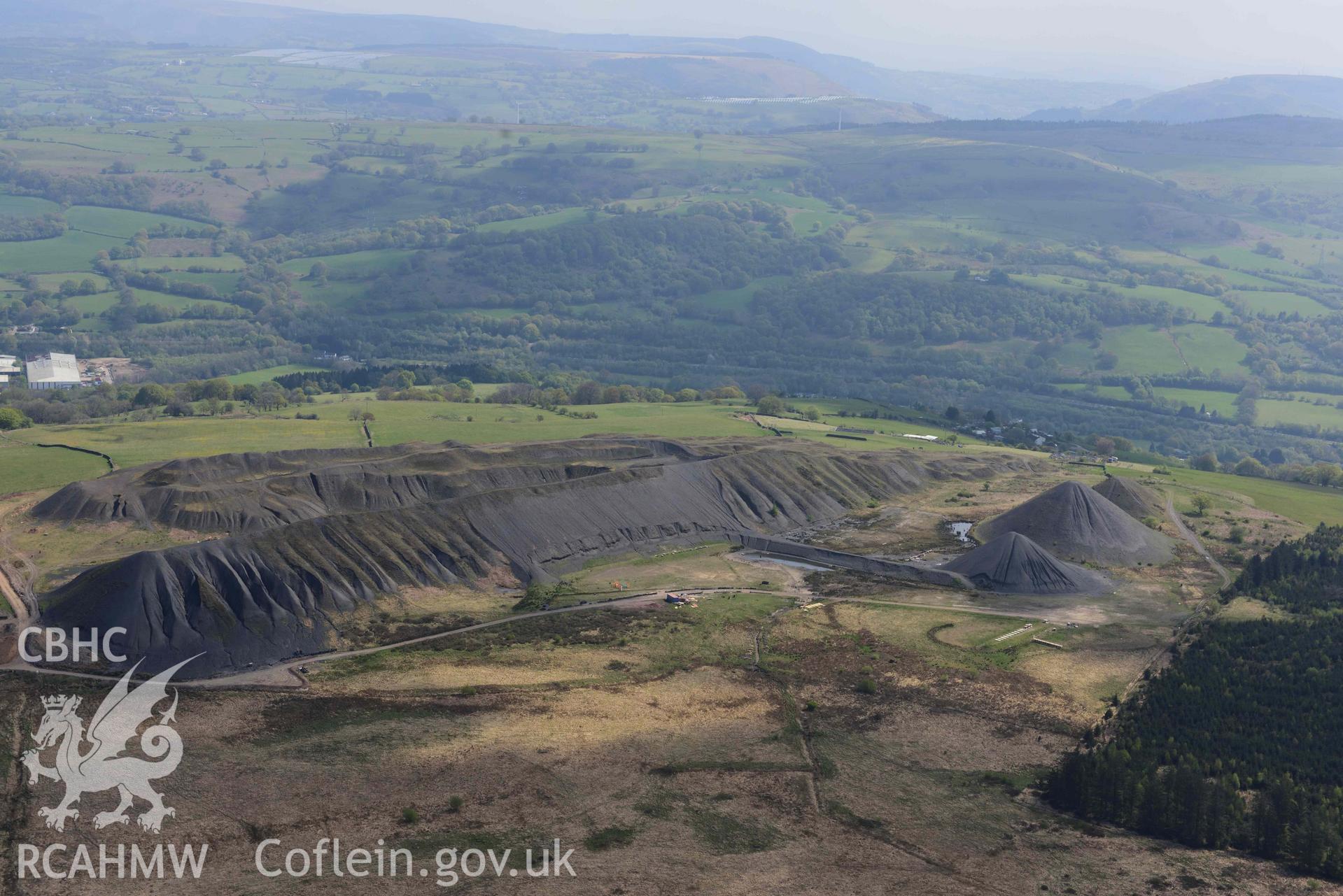 Llanbradach Colliery spoil tips. Oblique aerial photograph taken during the Royal Commission's programme of archaeological aerial reconnaissance by Toby Driver on 29 April 2022.