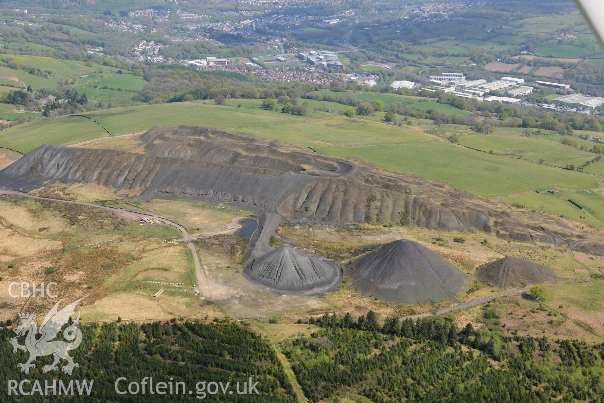Llanbradach Colliery spoil tips. Oblique aerial photograph taken during the Royal Commission's programme of archaeological aerial reconnaissance by Toby Driver on 29 April 2022.