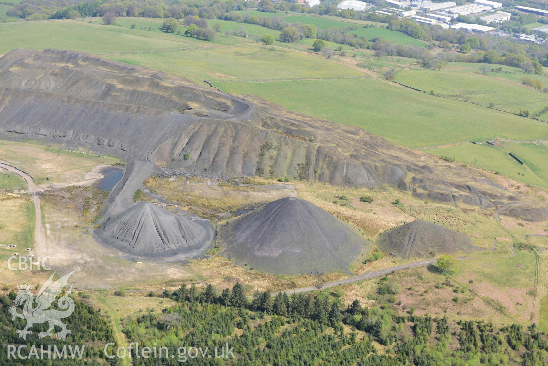 Llanbradach Colliery spoil tips. Oblique aerial photograph taken during the Royal Commission's programme of archaeological aerial reconnaissance by Toby Driver on 29 April 2022.