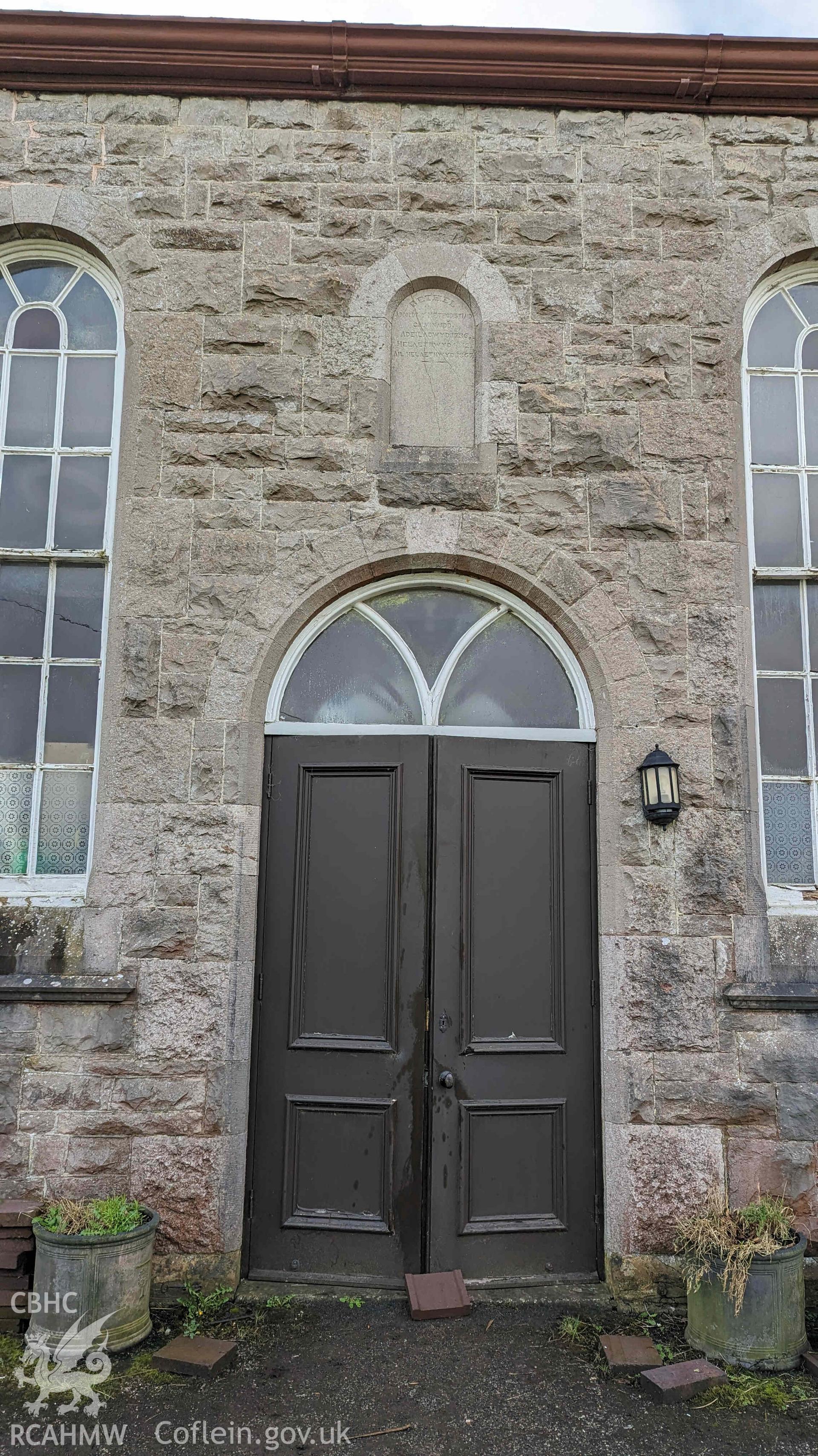 Photograph showing date stone above entrance, from a level 3 Historic Building Recording for Rhiw Chapel, carried out by Dee Archaeological Services as a condition of Listed Building Consent in March 2024.