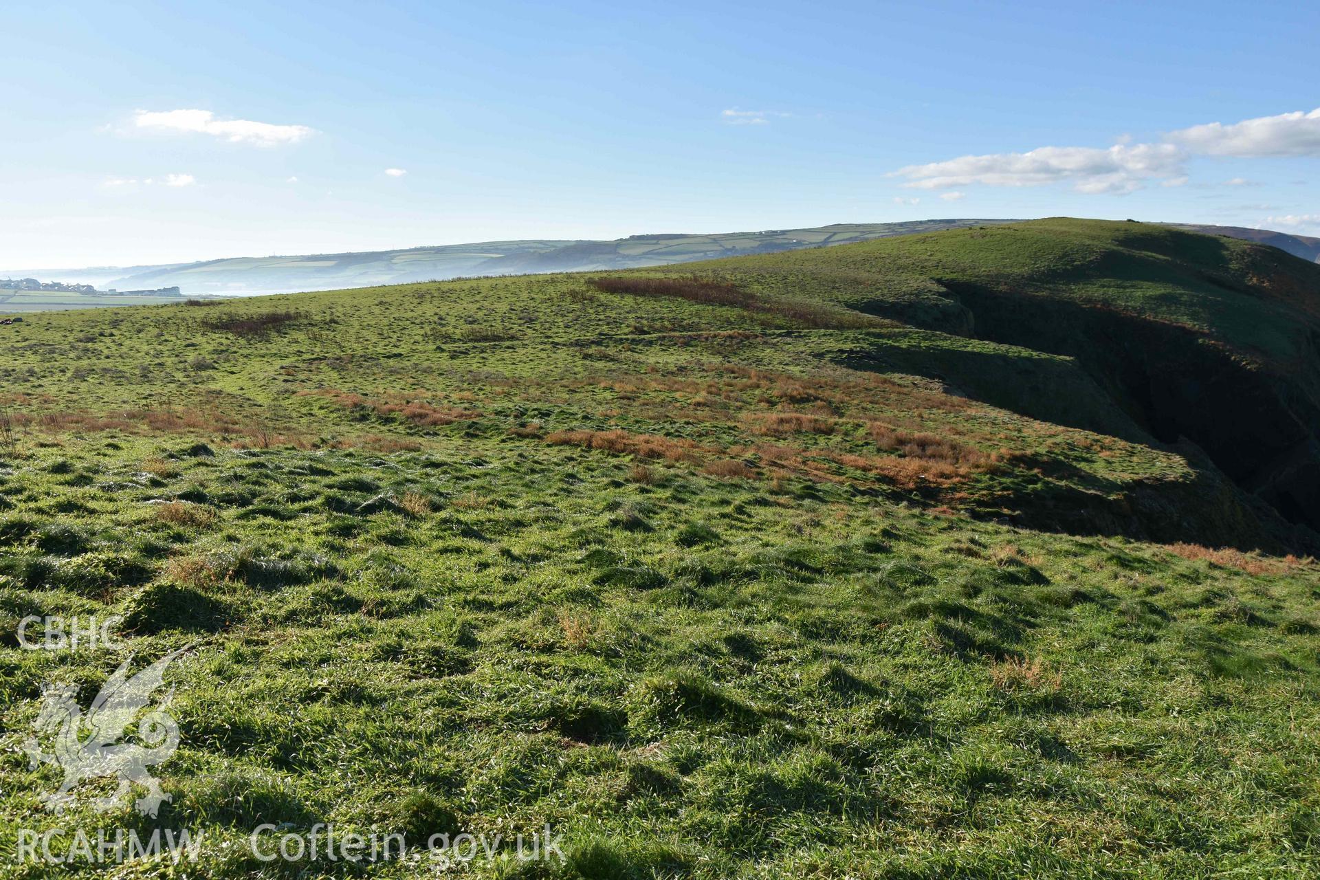 Promontory enclosure on Cardigan Island from the northeast. Part of a digital photographic survey conducted by Louise Barker of RCAHMW on 30 October 2018. Produced with EU funds through the Ireland Wales Co-operation Programme 2014-2023. All material made freely available through the Open Government Licence.