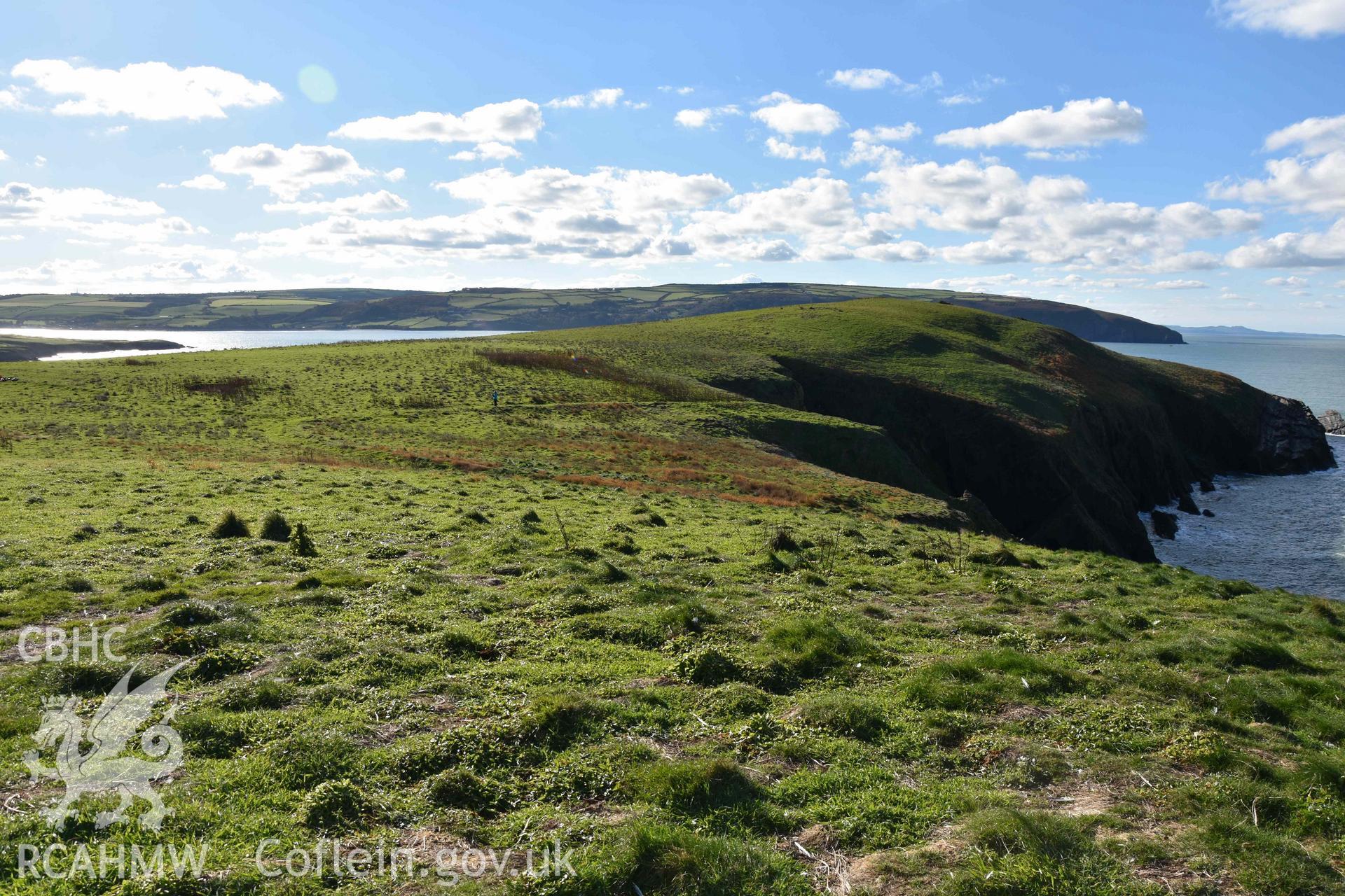 Promontory enclosure on Cardigan Island from the northeast. Part of a digital photographic survey conducted by Louise Barker of RCAHMW on 30 October 2018. Produced with EU funds through the Ireland Wales Co-operation Programme 2014-2023. All material made freely available through the Open Government Licence.
