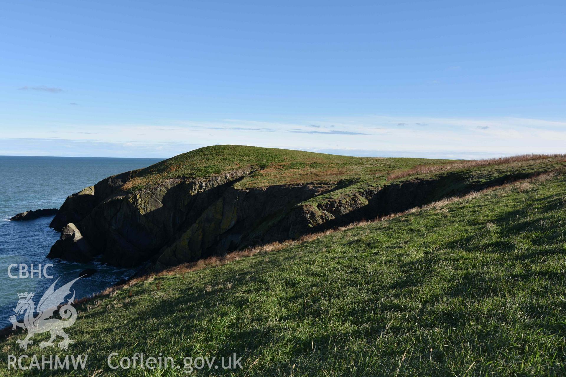 Promontory enclosure on Cardigan Island from the west. Part of a digital photographic survey conducted by Louise Barker of RCAHMW on 30 October 2018. Produced with EU funds through the Ireland Wales Co-operation Programme 2014-2023. All material made freely available through the Open Government Licence.