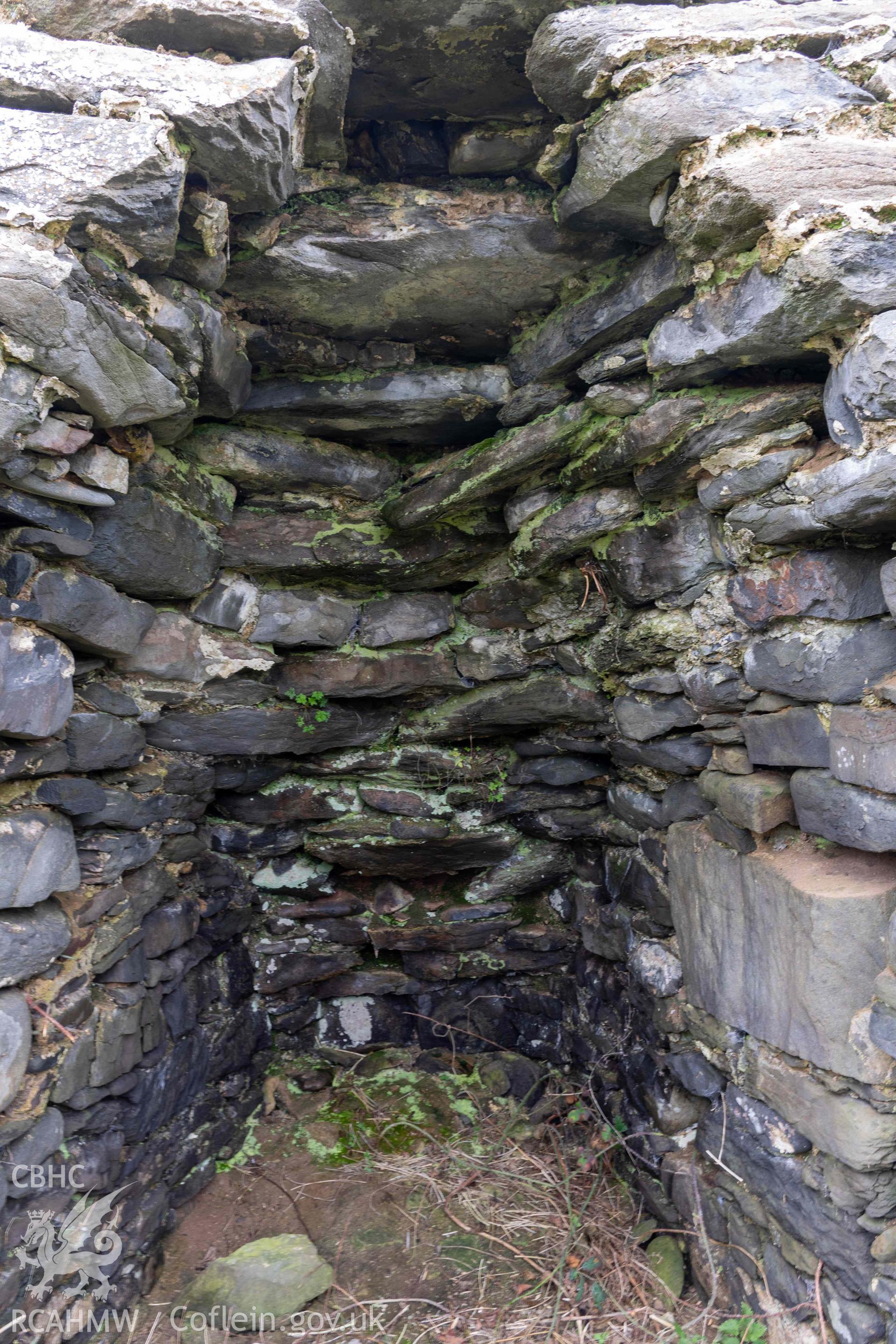 Kiln 3, draw-hole in kiln-eye, north elevation. Part of photographic survey of Aberstrincell lime kilns and coal yard, conducted by Louise Barker of the RCAHMW survey team on 21 March 2024.