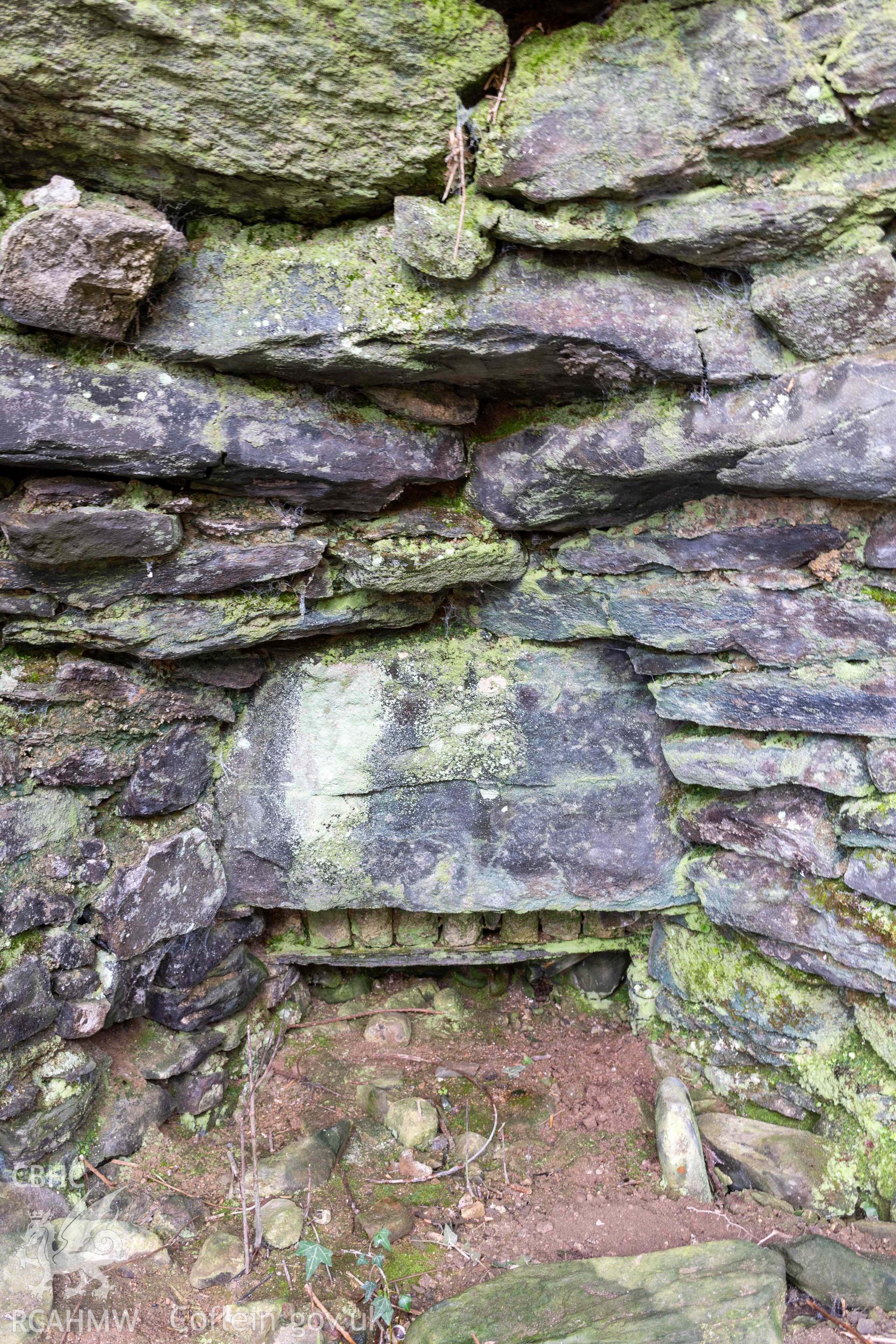 Kiln 3, draw-hole in kiln-eye, west elevation. Part of photographic survey of Aberstrincell lime kilns and coal yard, conducted by Louise Barker of the RCAHMW survey team on 21 March 2024.