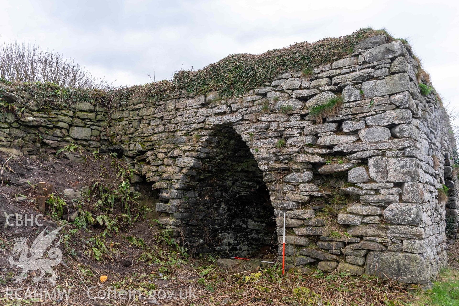 Kiln 2, east elevation (with scale). Part of photographic survey of Aberstrincell lime kilns and coal yard, conducted by Louise Barker of the RCAHMW survey team on 21 March 2024.