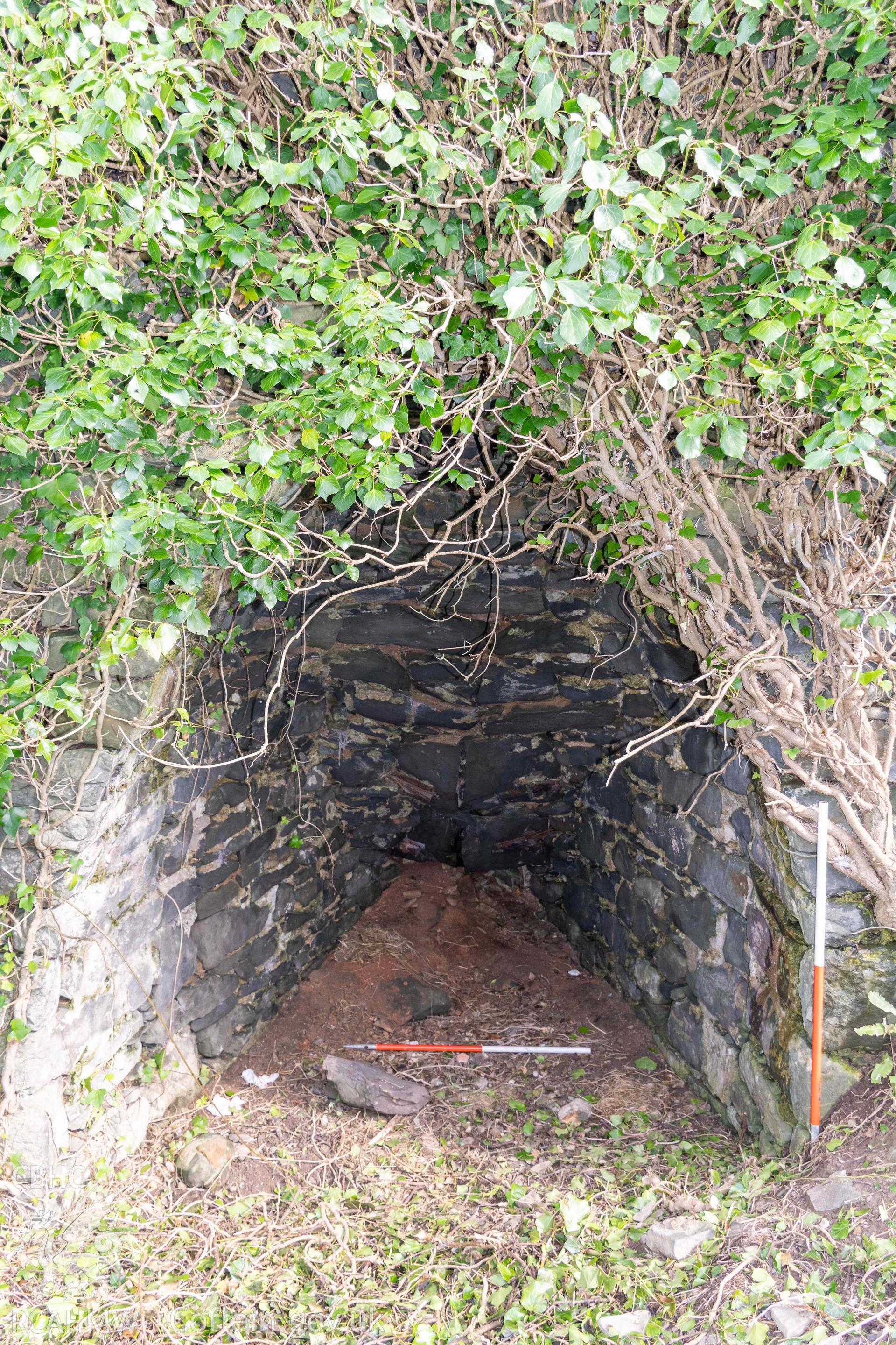 Kiln 1, kiln-eye, west elevation (with scale). Part of photographic survey of Aberstrincell lime kilns and coal yard, conducted by Louise Barker of the RCAHMW survey team on 21 March 2024.