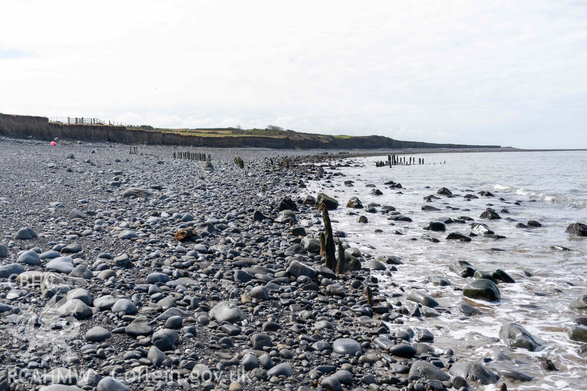 Groyne (SN5213968609) and Jetty (SN5214268626), Aberstrincell, looking southwest. Part of photographic survey of Aberstrincell lime kilns and coal yard, conducted by Louise Barker of the RCAHMW survey team on 21 March 2024.