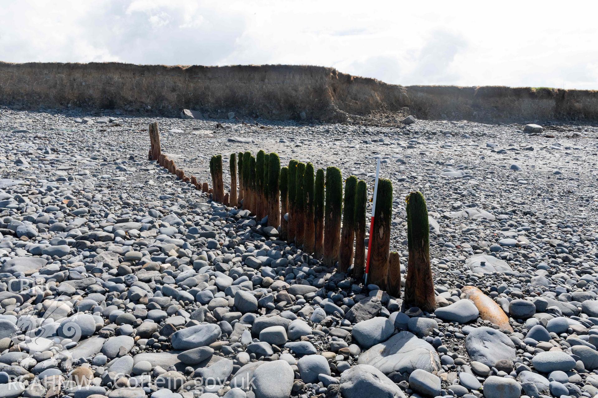 Groyne (SN5213968609), Aberstrincell, looking south (with scale). Part of photographic survey of Aberstrincell lime kilns and coal yard, conducted by Louise Barker of the RCAHMW survey team on 21 March 2024.